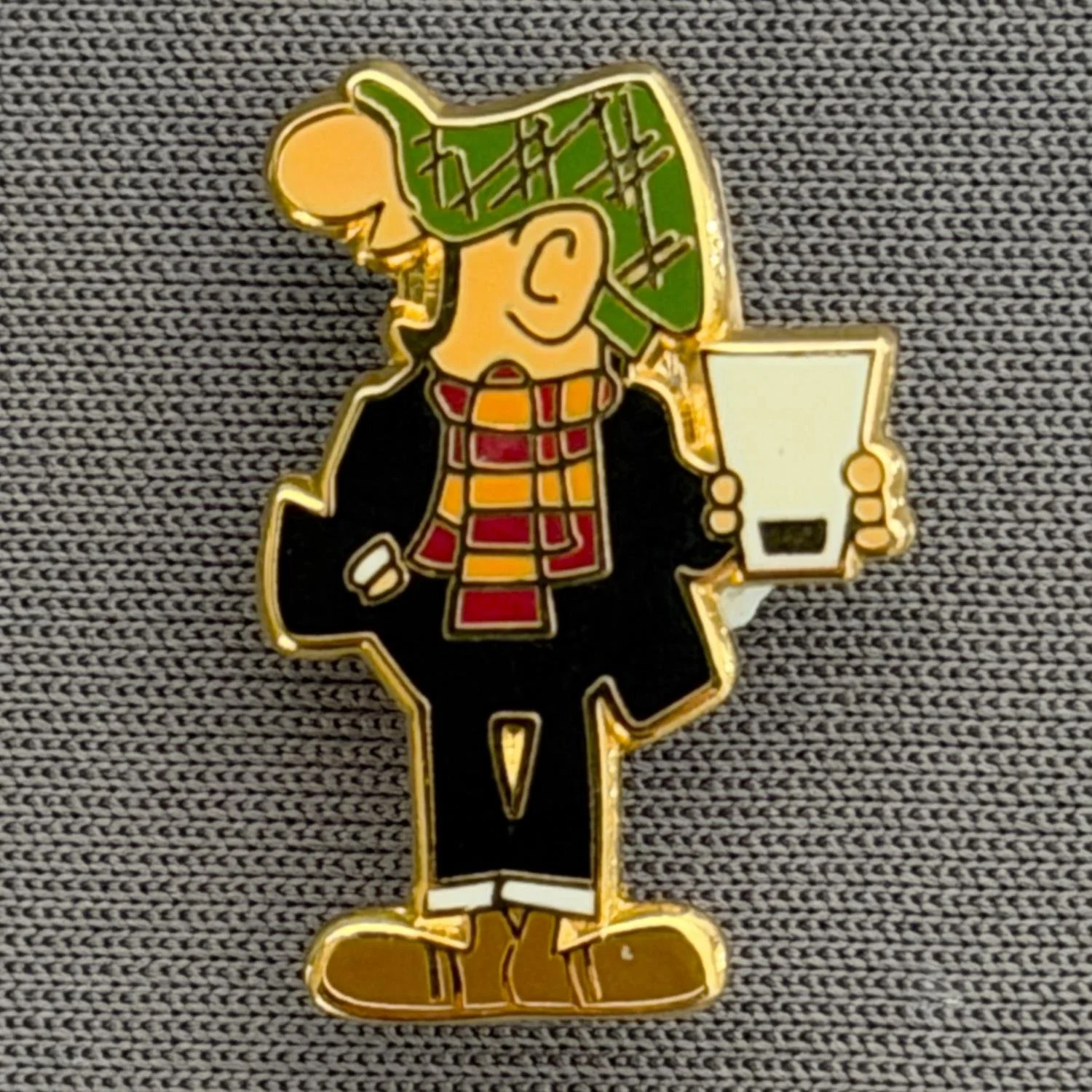 Reference Number: BCCTN030
Size: H 20.1 mm x W 13.8 mm
Pin Type: Brooch Pin
Plating: Gold
Value: £6
Manufacturer: Not Known
Comments: Andy Capp in Bradford City Kit