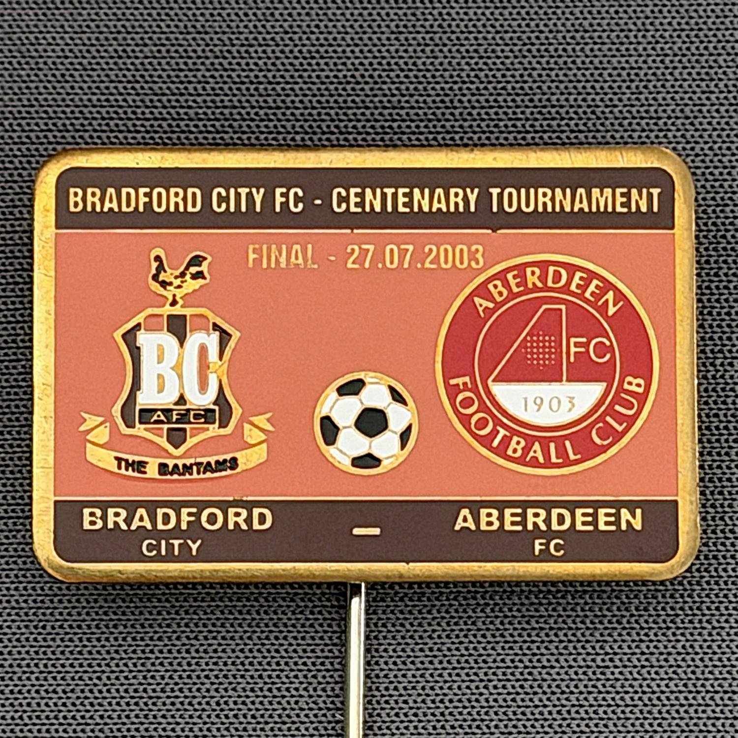 Reference Number: BCEVE022
Size: H 19.9 mm x W 30.1 mm
Pin Type: Stick Pin
Plating: Brass
Value: £12
Manufacturer: Russian
Comments: City v Aberdeen, Centenary Tournament 2003, Claret & Amber