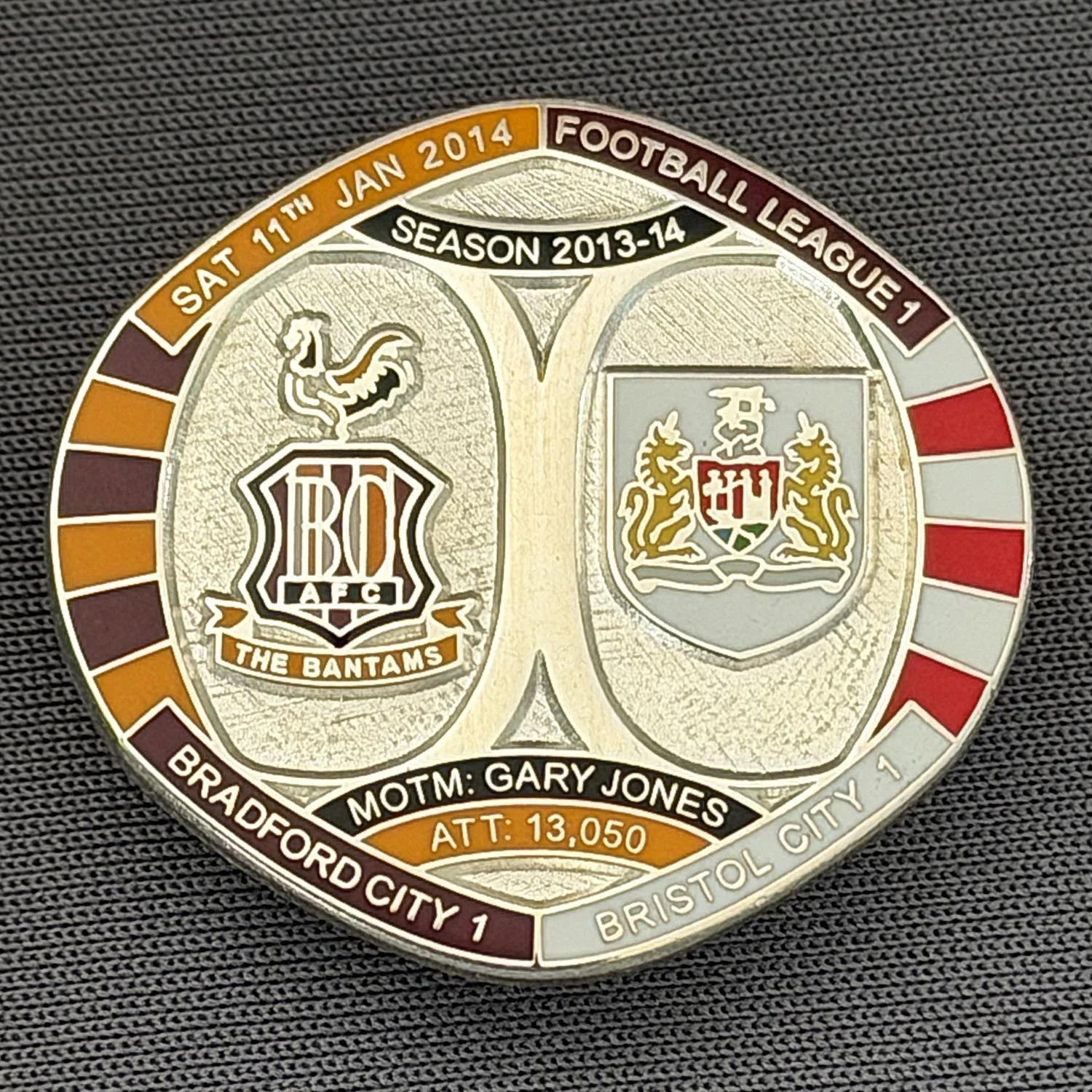 Reference Number: BCFIX220
Size: H 26.3 mm x W 28.9 mm
Pin Type: Brooch Pin
Plating: Silver
Value: £10
Manufacturer: Bradford City Badges
Comments: Bradford City v Bristol City  2013/14 Limited Edition 10 Badges (Silver Version)