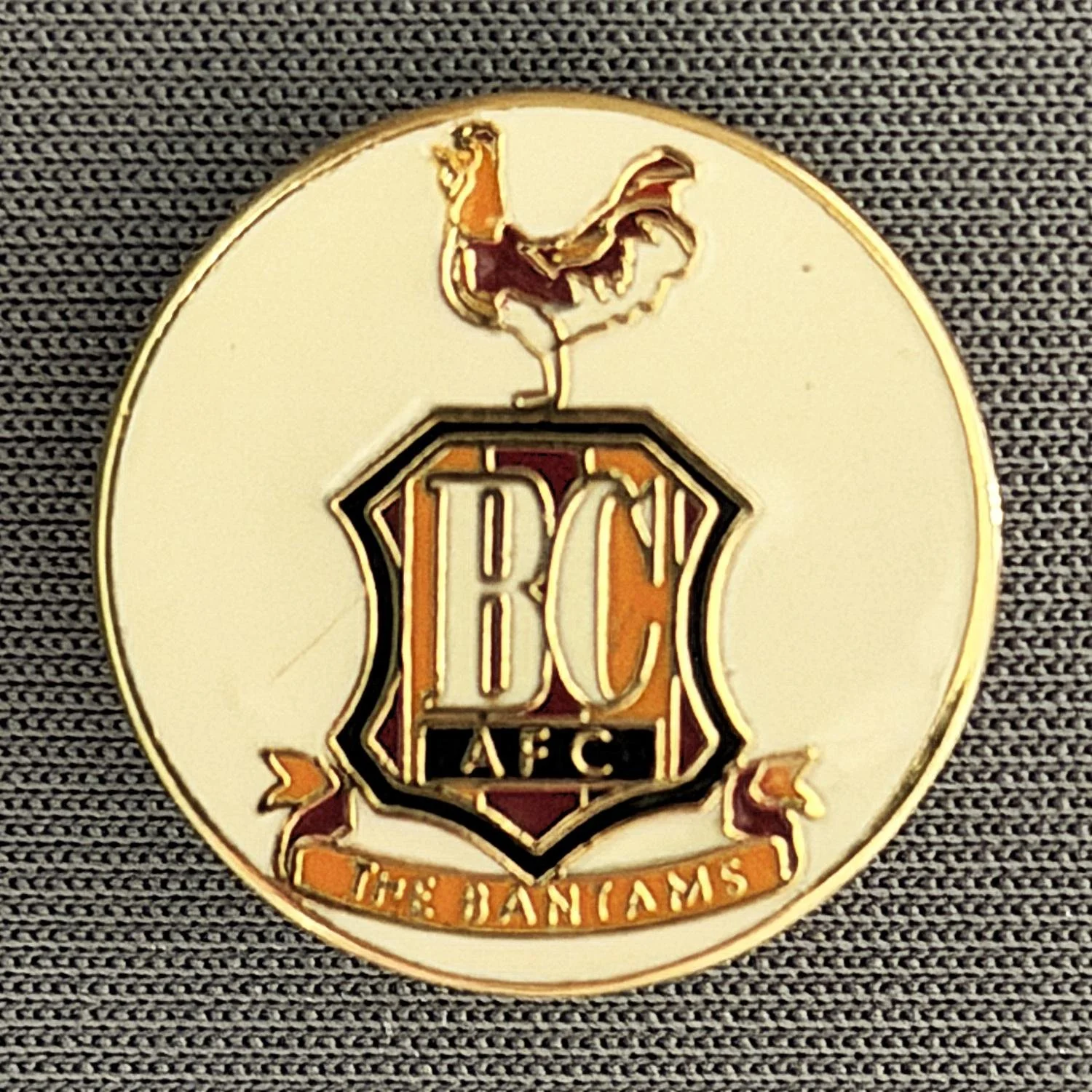 Reference Number: BCC&L011
Size: D 18.9 mm
Pin Type: Brooch Pin
Plating: Gold
Value: £8
Manufacturer: Unknown
Comments: Circular White City Logo