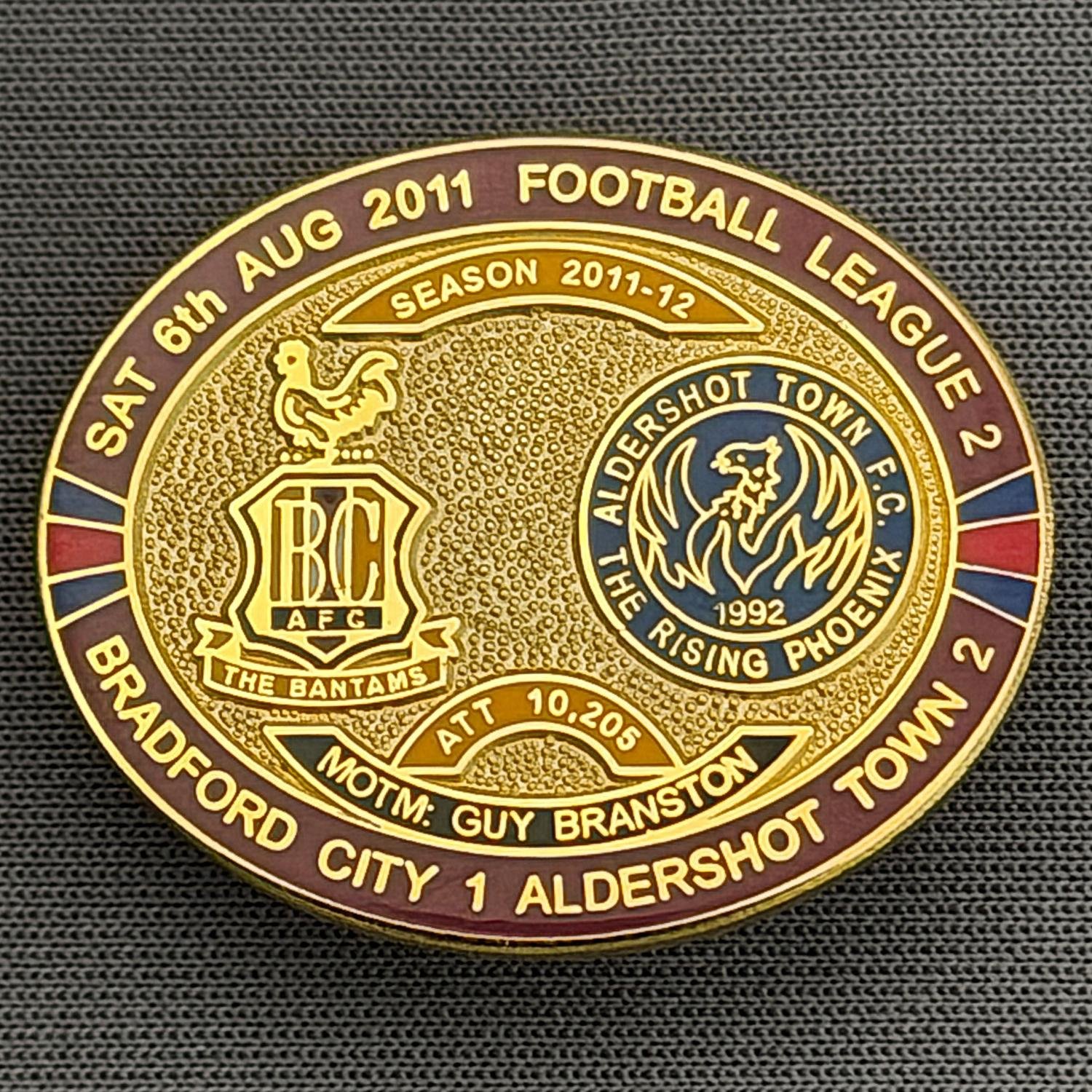 Reference Number: BCFIX070
Size: H 23.6 mm x W 28.7 mm
Pin Type: Brooch Pin
Plating: Gold
Value: £8
Manufacturer: Bradford City Badges
Comments: Bradford City v Aldershot Town  2011/12 Limited Edition 80 Badges