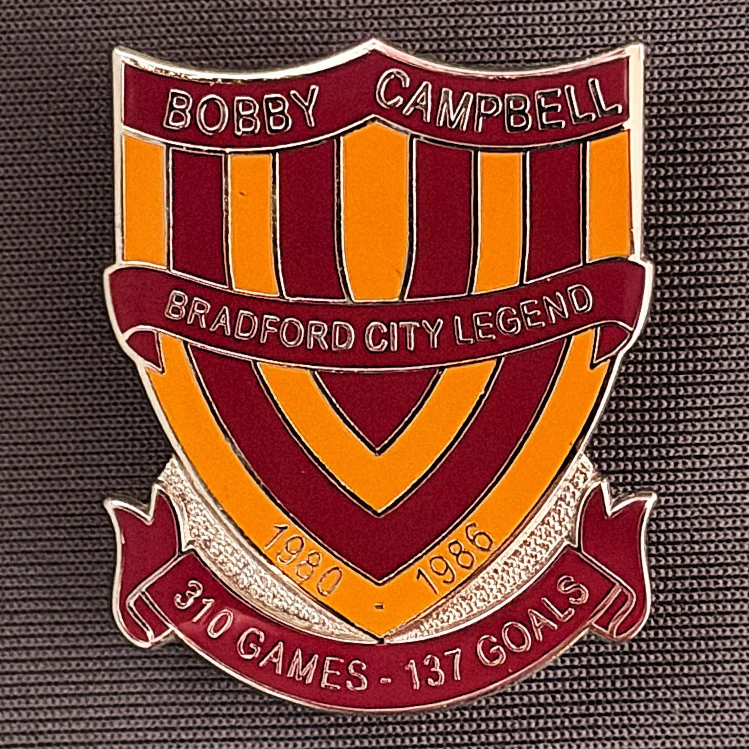 Reference Number: BCUN015
Size: H 32 mm x W 25.9 mm
Pin Type: Metal Clutch
Plating: Silver
Value: £10
Manufacturer: Bradford City Badges
Comments: Bobby Campbell Limited Edition of 25. Boxed Set of 4. Issued 2012. Claret & Amber Version.