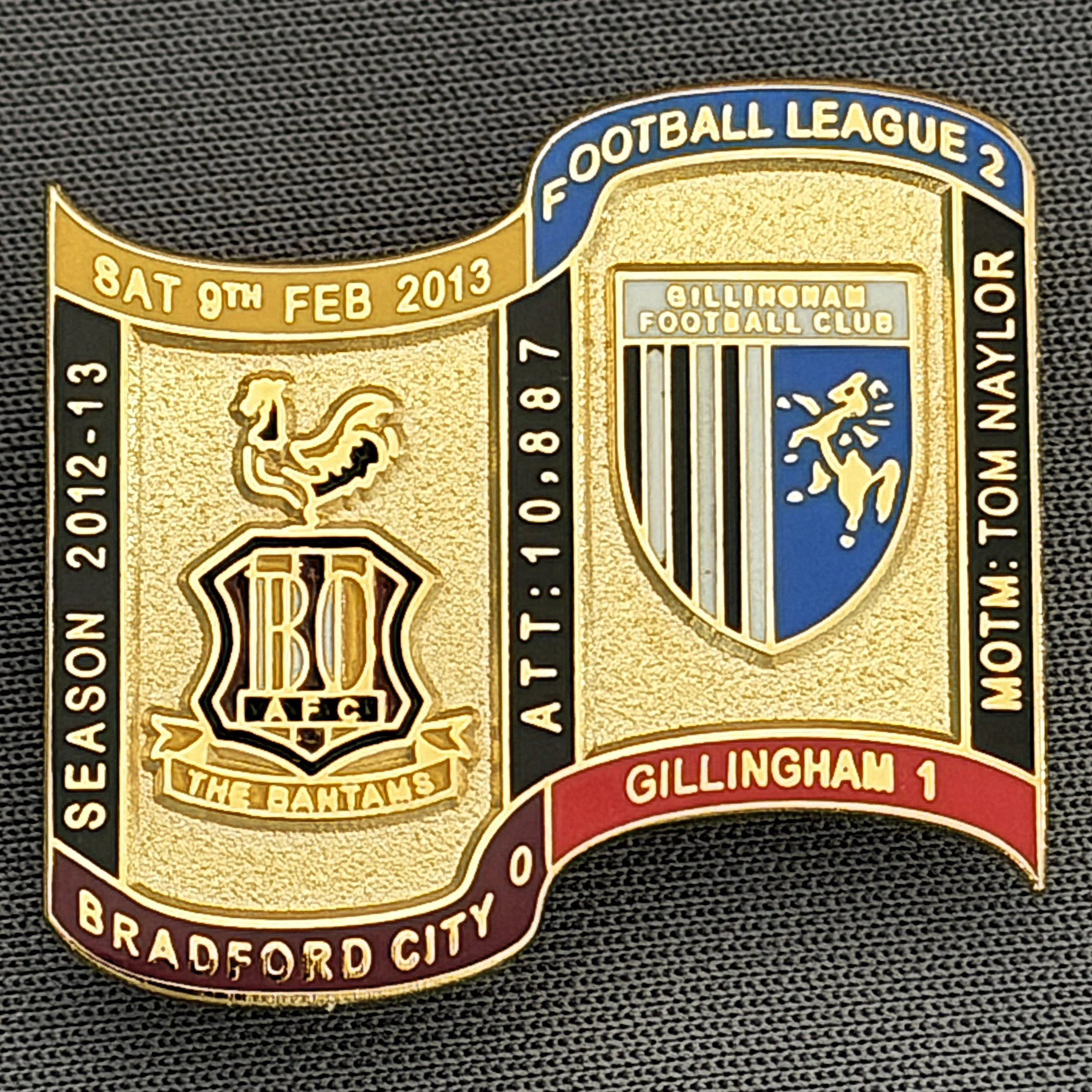 Reference Number: BCFIX130
Size: H 26.9 mm x W 29.2 mm
Pin Type: Brooch Pin
Plating: Gold
Value: £8
Manufacturer: Bradford City Badges
Comments: Bradford City v Gillingham 2012/13 Limited Edition 65 Badges