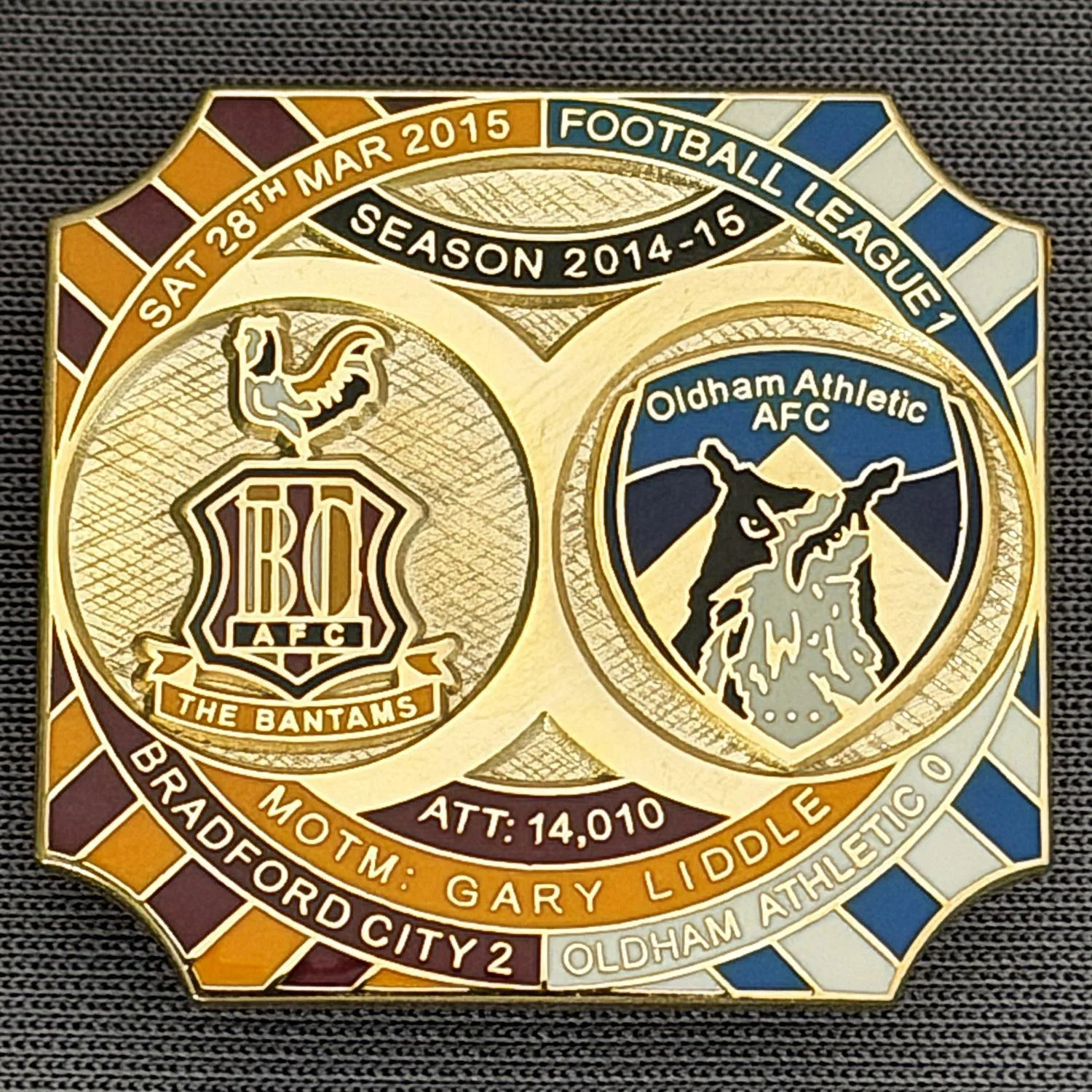 Reference Number: BCFIX272
Size: H 26.8 mm x W 28.8 mm
Pin Type: Brooch Pin
Plating: Gold
Value: £8
Manufacturer: Bradford City Badges
Comments: Bradford City v Oldham Athletic 2014/15, Limited Edition of 50 Badges (Gold Version)