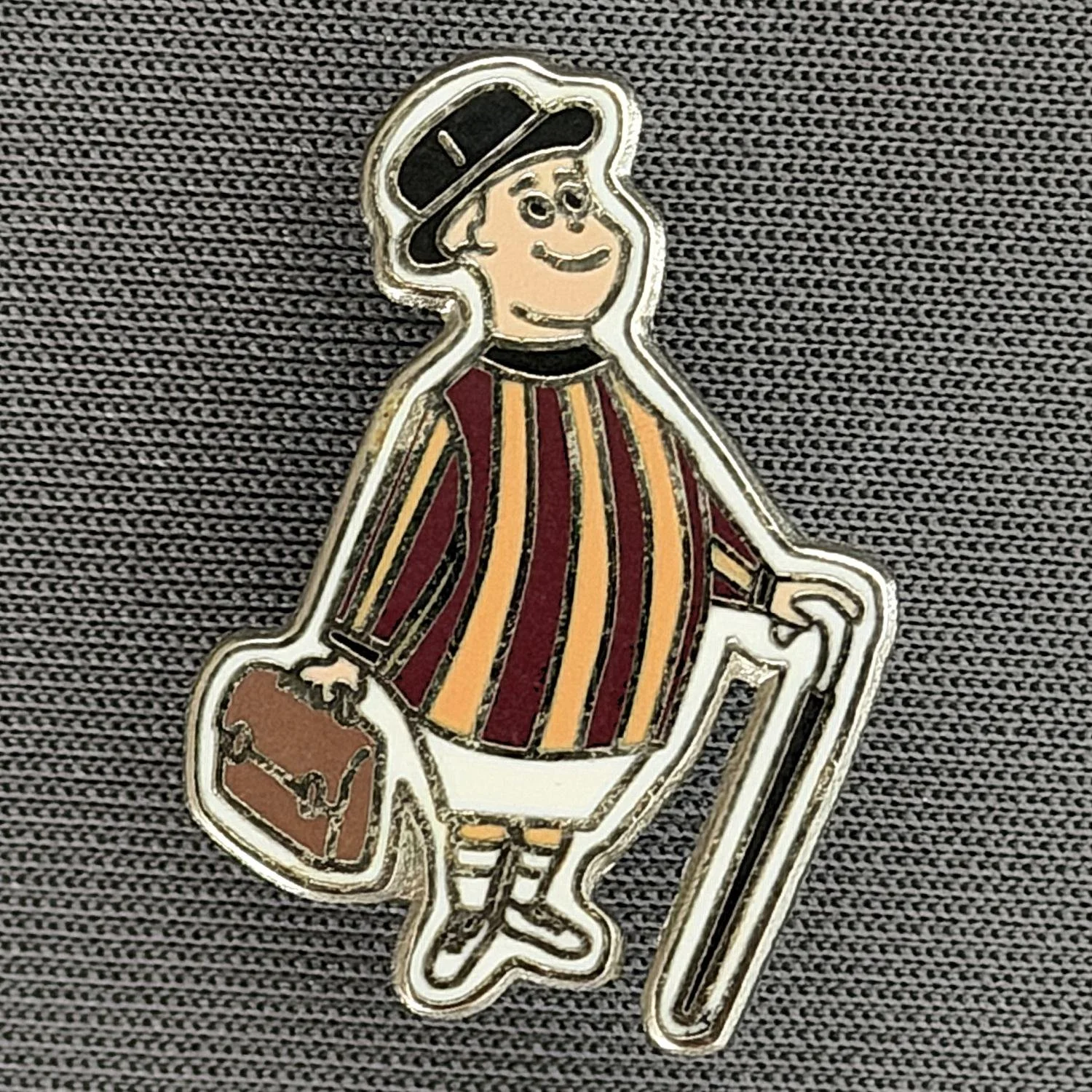 Reference Number: BCGEN101
Size: H 24 mm x W 17.6 mm
Pin Type: Brooch Pin
Plating: Silver
Value: £6
Manufacturer: Unknown
Comments: City Gent, White Outline, White Shorts