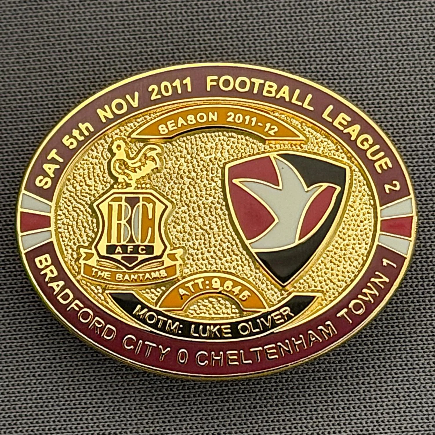 Reference Number: BCFIX077
Size: H 23.6 mm x W 28.7 mm
Pin Type: Brooch Pin
Plating: Gold
Value: £8
Manufacturer: Bradford City Badges
Comments: Bradford City v Cheltenham Town  2011/12 Limited Edition 80 Badges