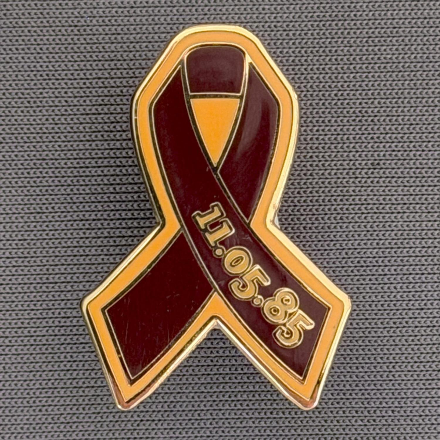 Reference Number: BCFIR017
Size: H 25.7 mm x W 17.8 mm
Pin Type: Metal Clutch
Plating: Gold
Value: £10
Manufacturer: Friends of Bradford City
Comments: Limited Edition of 50, Claret & Amber ribbon, to raise money for the PSBRU.
