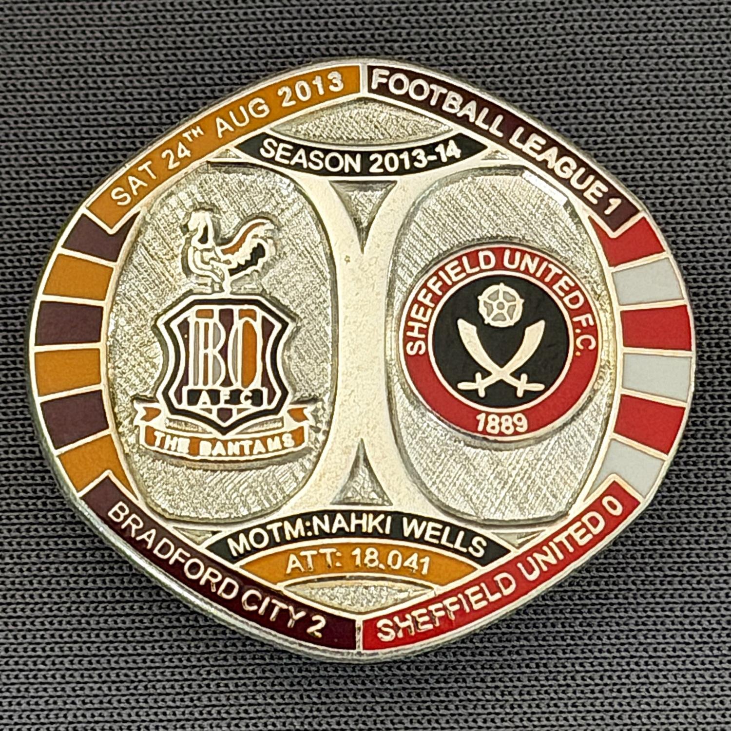 Reference Number: BCFIX209
Size: H 26.3 mm x W 28.9 mm
Pin Type: Brooch Pin
Plating: Silver
Value: £10
Manufacturer: Bradford City Badges
Comments: Bradford City v Sheffield United  2013/14 Limited Edition 10 Badges (Silver Version)