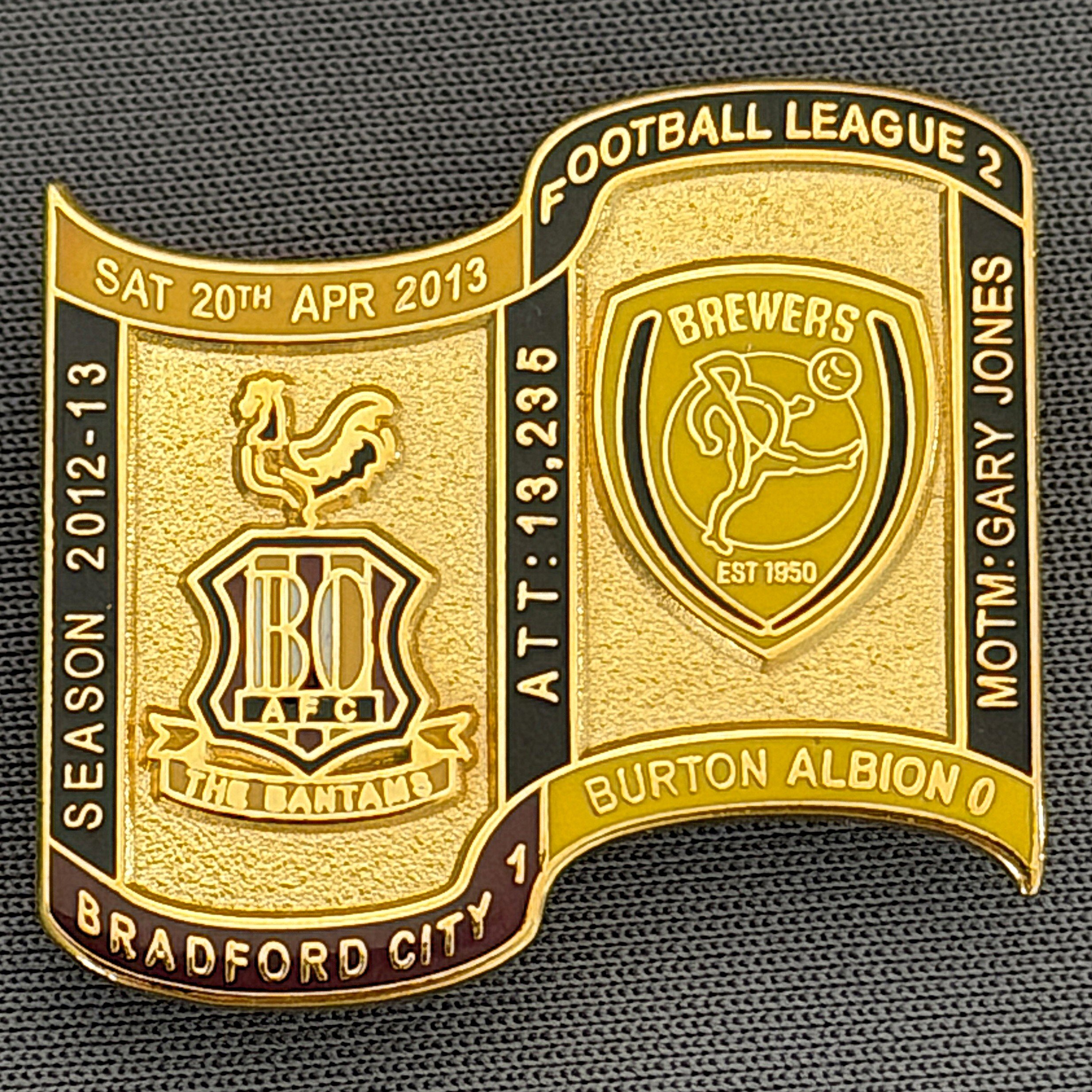 Reference Number: BCFIX138
Size: H 26.9 mm x W 29.2 mm
Pin Type: Brooch Pin
Plating: Gold
Value: £8
Manufacturer: Bradford City Badges
Comments: Bradford City v Burton Albion 2012/13 Limited Edition 65 Badges