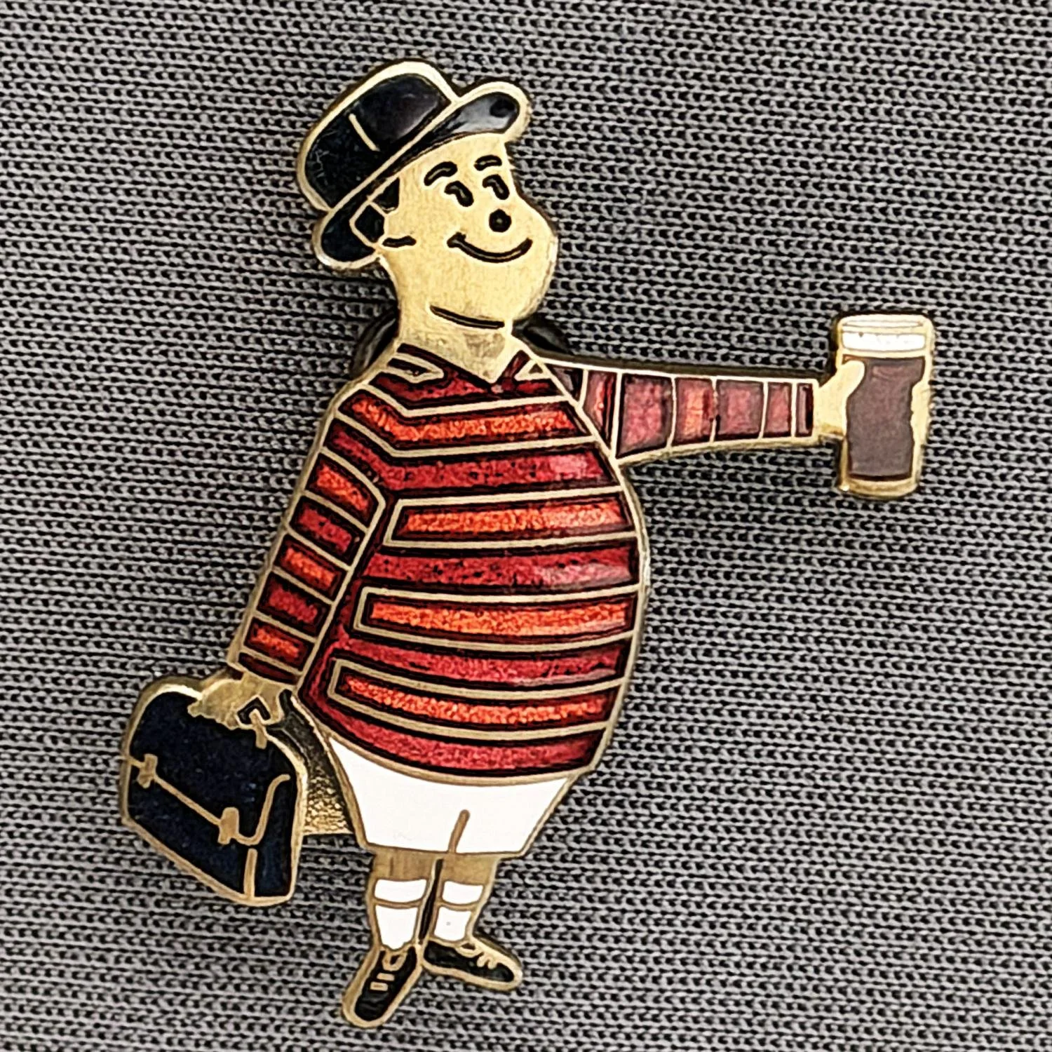 Reference Number: BCGEN075
Size: H 28.8 mm x W 20.9 mm
Pin Type: Brooch Pin
Plating: Antique Bronze
Value: £20
Manufacturer: Bradford City Badges
Comments: City Gent Beer Cloisonne, Black Briefcase. One Off Badge.