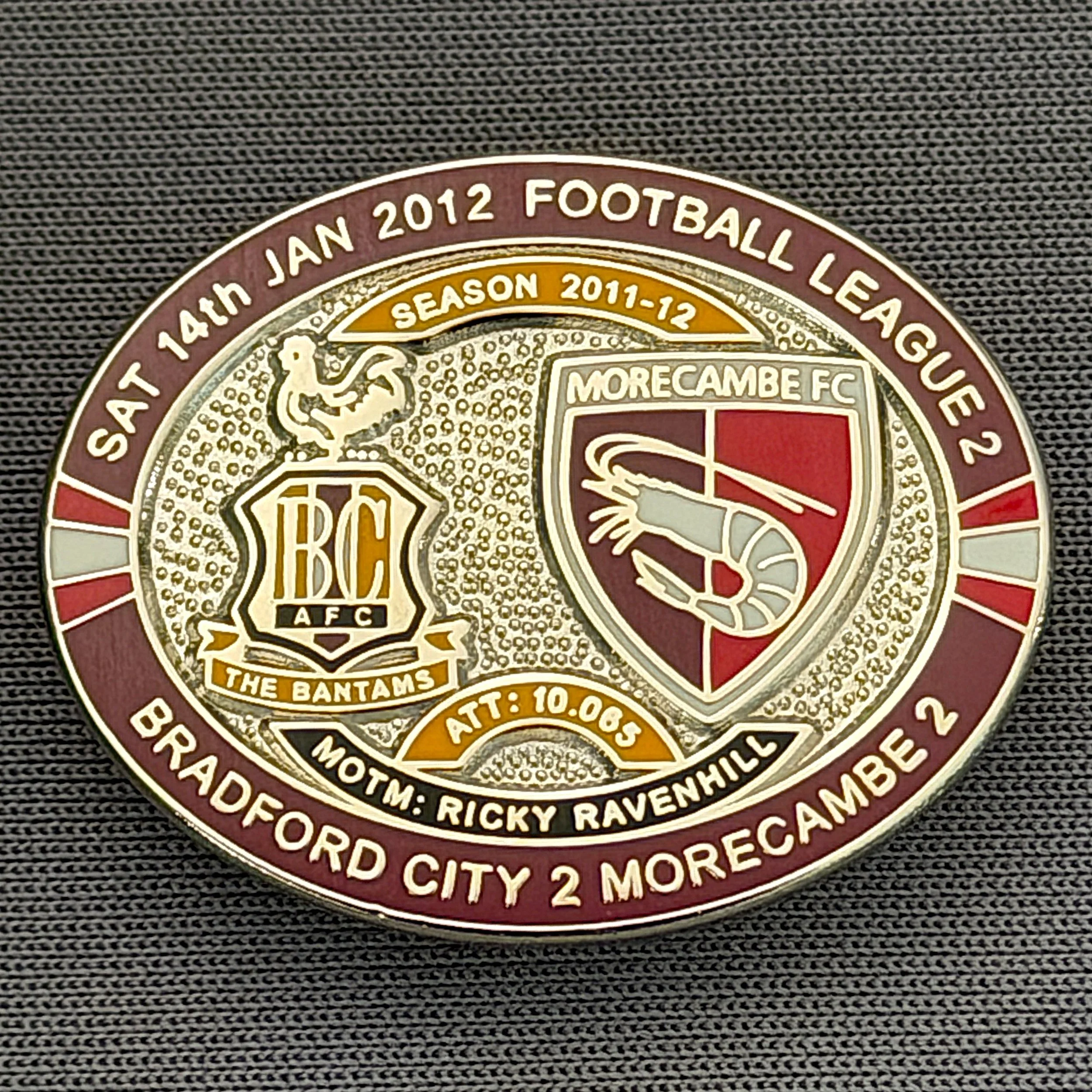 Reference Number: BCFIX105
Size: H 23.6 mm x W 28.7 mm
Pin Type: Brooch Pin
Plating: Silver
Value: £10
Manufacturer: Bradford City Badges
Comments: Bradford City v Morecambe  2011/12 Limited Edition 20 Badges (Silver Version)