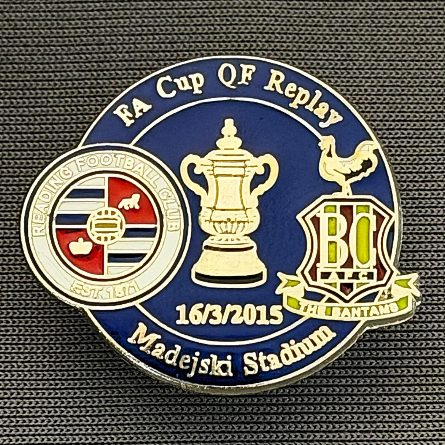 Reference Number: BCFAC130
Size: H 21.9 mm x W 26 mm
Pin Type: Metal Clutch
Plating: Silver
Value: £4
Manufacturer: Dan Lloyd
Comments: F.A. Cup Quarter Final Replay 2014/15, Away v Reading, Blue Version