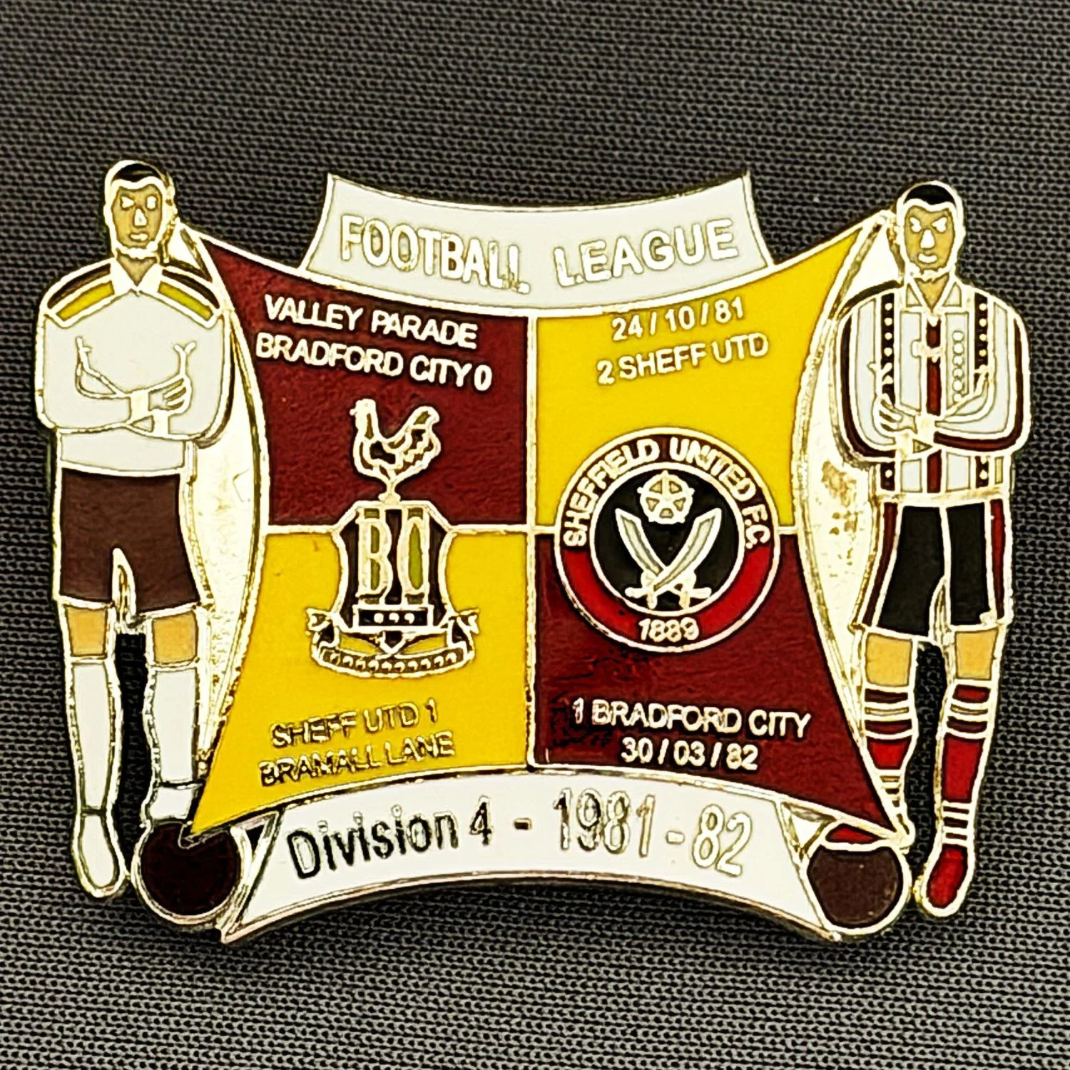Reference Number: BCOFIX050
Size: H 30.1 mm x W 38 mm
Pin Type: Double Metal Clutch
Plating: Silver
Value: £8
Manufacturer: Unknown
Comments: Bradford City v Sheffield United 1981/82 Division 4, Claret & Amber Version