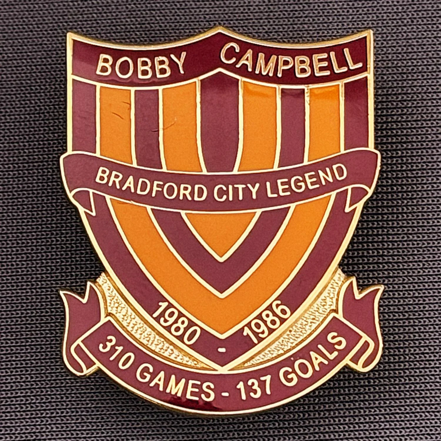 Reference Number: BCUN011
Size: H 32 mm x W 25.9 mm
Pin Type: Metal Clutch
Plating: Gold
Value: £10
Manufacturer: Bradford City Badges
Comments: Bobby Campbell Limited Edition of 25, Boxed Set of 4. Issued 2012. Claret & Amber Version.
