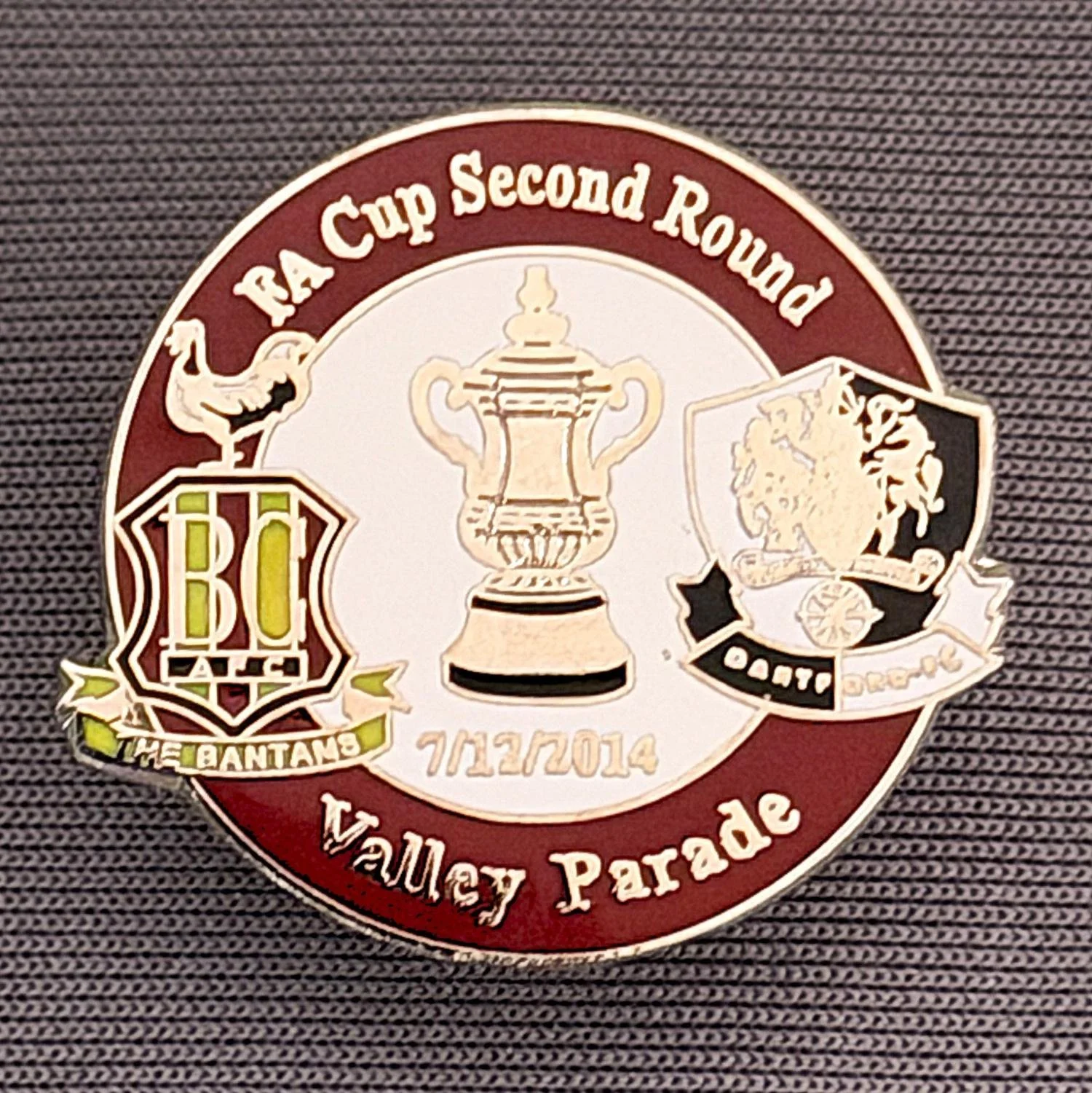 Reference Number: BCFAC067
Size: H 23.3 mm x W 25.6 mm
Pin Type: Metal Clutch
Plating: Silver
Value: £4
Manufacturer: Dan Lloyd
Comments: F.A. Cup Second Round 2014/15, v Dartford, Claret & White Version