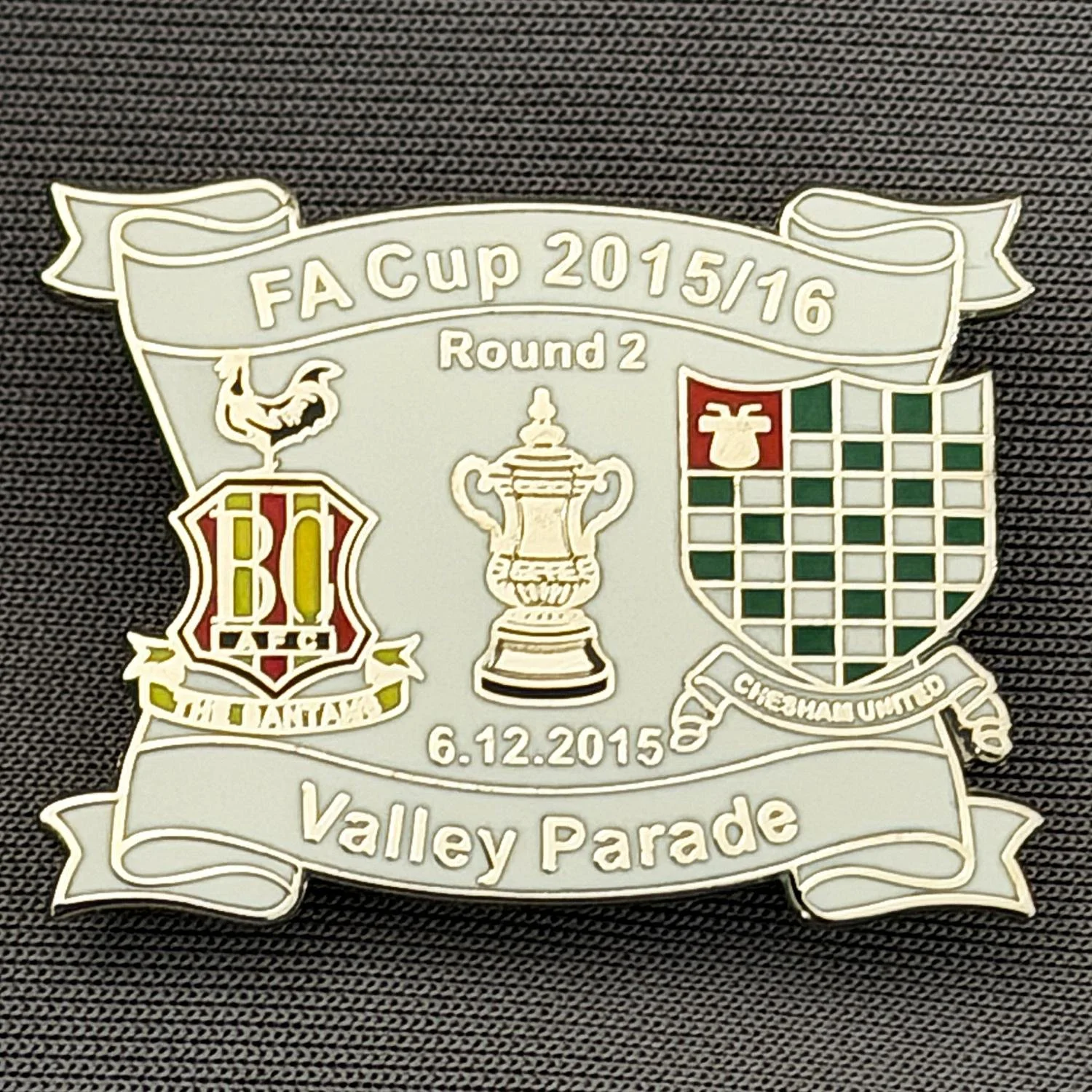 Reference Number: BCFAC145
Size: H 24.5 mm x W 32.5 mm
Pin Type: Metal Clutch
Plating: Silver
Value: £4
Manufacturer: Dan Lloyd
Comments: F.A. Cup Second Round 2015/16 v Chesham United, White Version