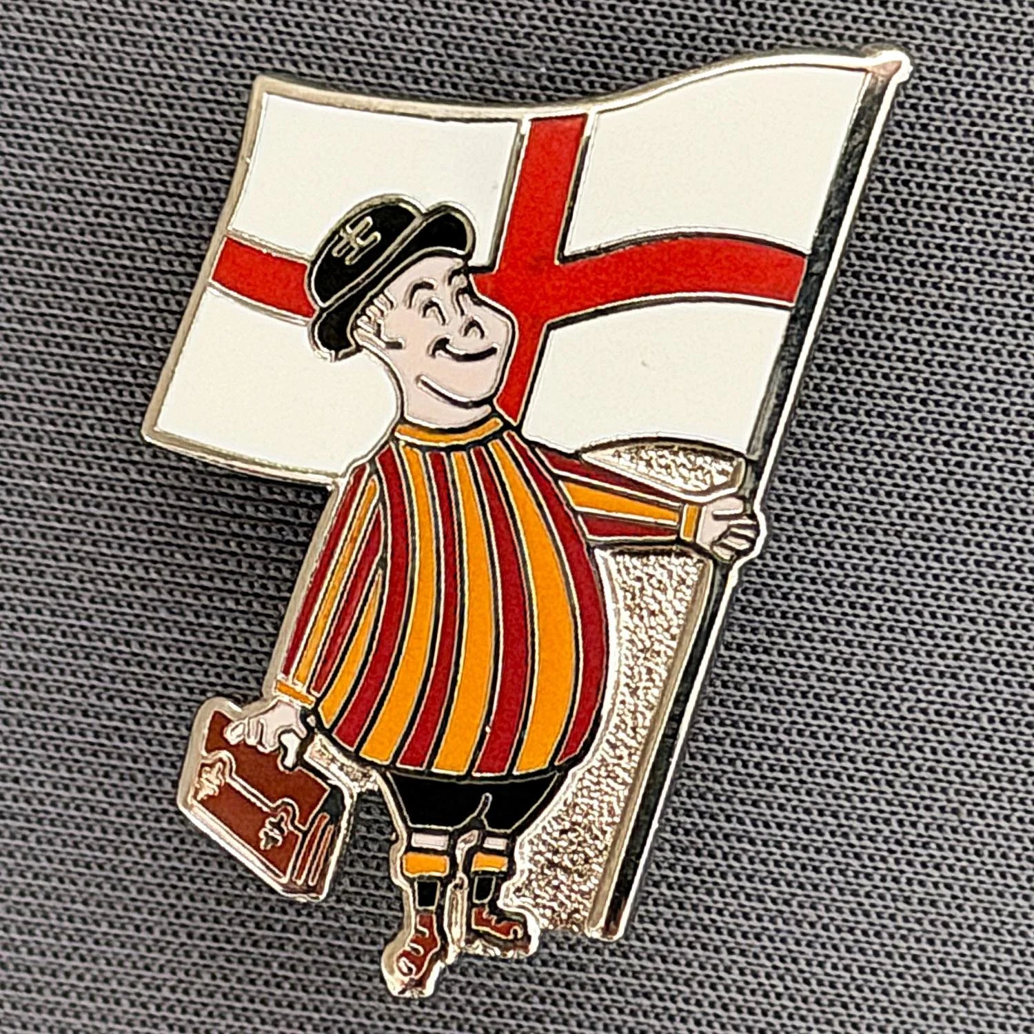 Reference Number: BCGEN040
Size: H 31.7 mm x W 18.6 mm
Pin Type: Brooch Pin
Plating: Silver
Value: £8
Manufacturer: Paraders
Comments: City Gent, St. George's Flag. Badge also Feature in Flags Section