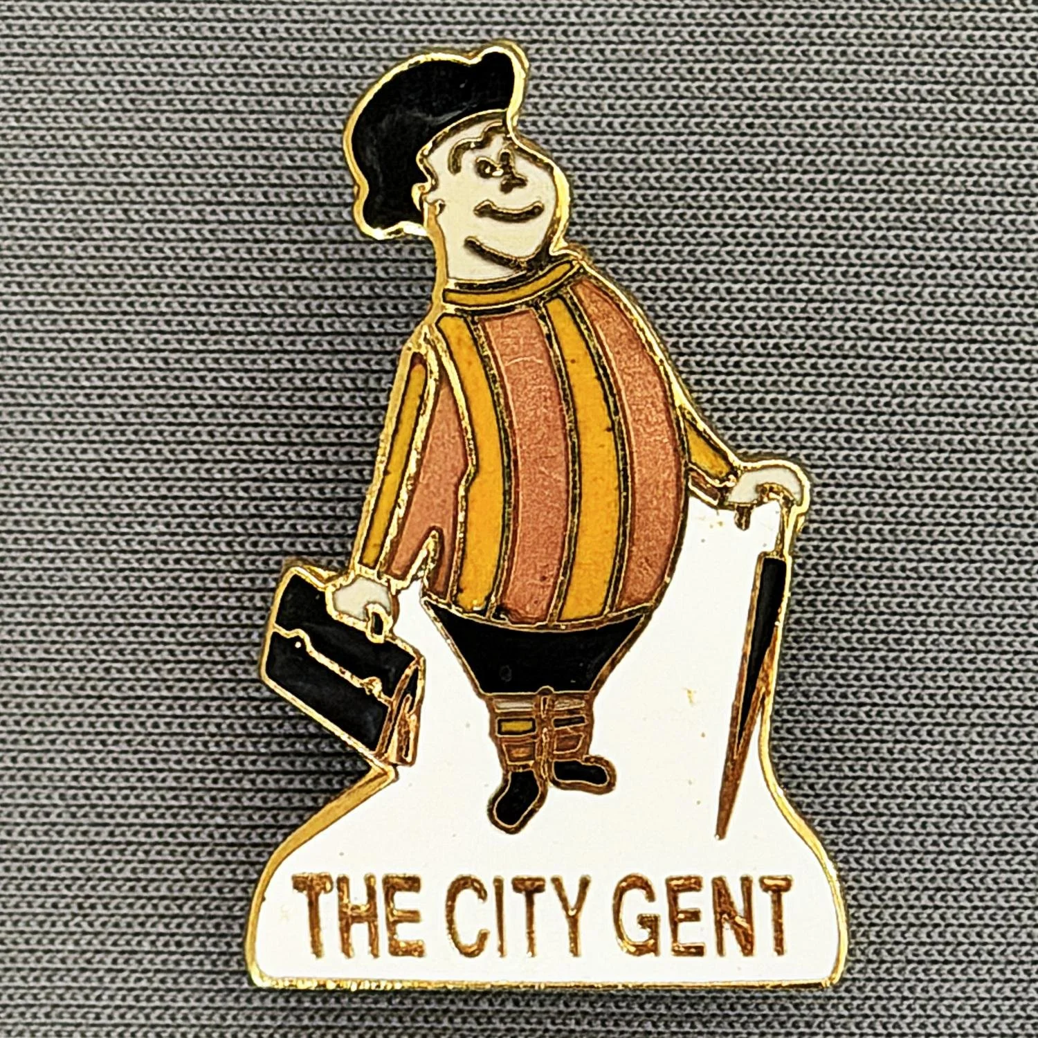 Reference Number: BCGEN009
Size: H 30 mm x W 19.3 mm
Pin Type: Metal Clutch
Plating: Gold
Value: £10
Manufacturer: Unknown
Comments: The City Gent