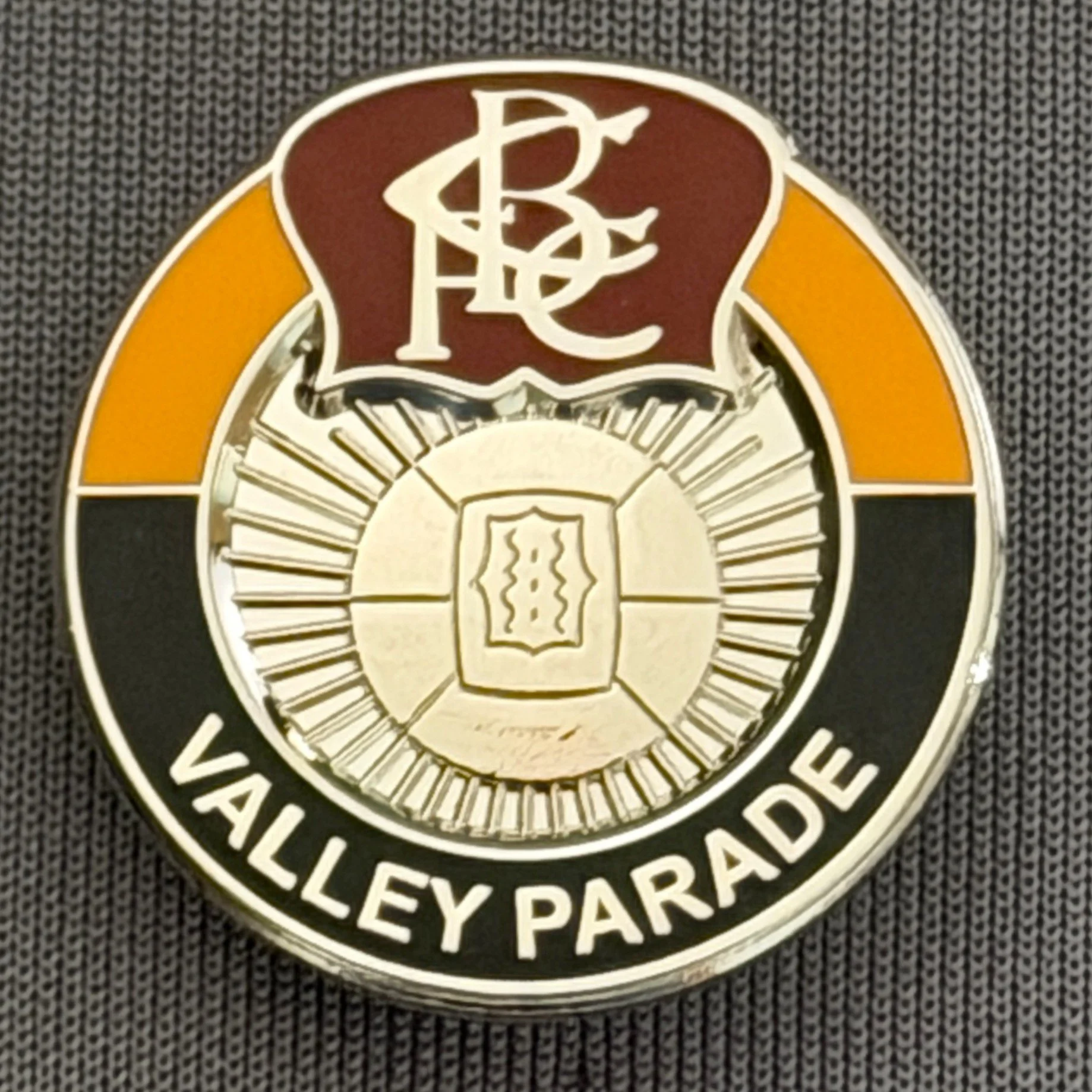 Reference Number: BCVP015
Size: H 24.2 mm x W 23.6 mm
Pin Type: Brooch Pin
Plating: Silver
Value: £4
Manufacturer: Unknown
Comments: Claret, Amber & Black, Bradford Park Avenue Style, Valley Parade