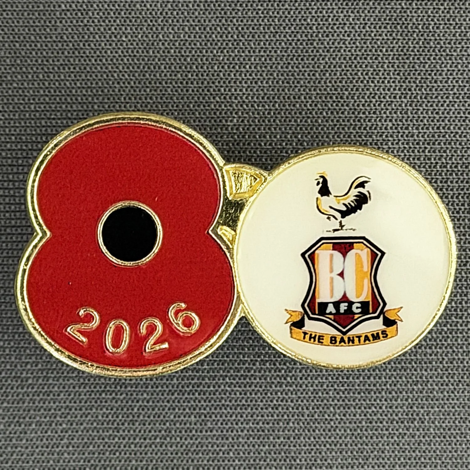 Reference Number: BCPOP008
Size: H 20.2 mm x W 33.2 mm
Pin Type: Metal Clutch
Plating: Gold
Value: £6
Manufacturer: Royal British Legion
Comments: Bradford City Poppy 2026
