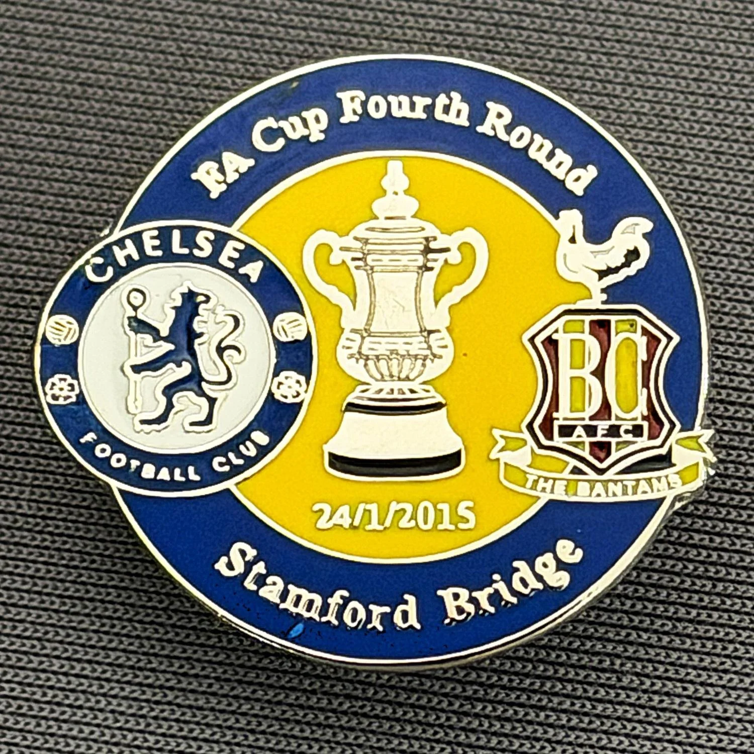Reference Number: BCFAC094
Size: H 23.3 mm x W 25.3 mm
Pin Type: Metal Clutch
Plating: Silver
Value: £4
Manufacturer: Dan Lloyd
Comments: F.A. Cup Fourth Round 2014/15, Away v Chelsea, Blue & Yellow Version