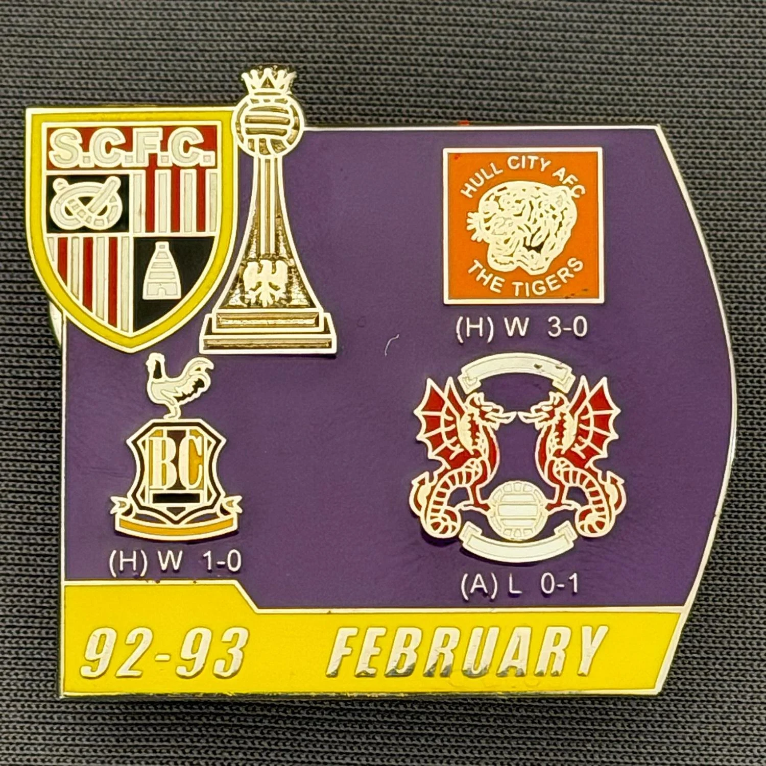 Reference Number: BCOFIX126
Size: H 34.6 mm x W 38.2 mm
Pin Type: Double Metal Clutch
Plating: Silver
Value: £5
Manufacturer: Unknown
Comments: Stoke City v Bradford City & Others 1993, Purple & Yellow Version 