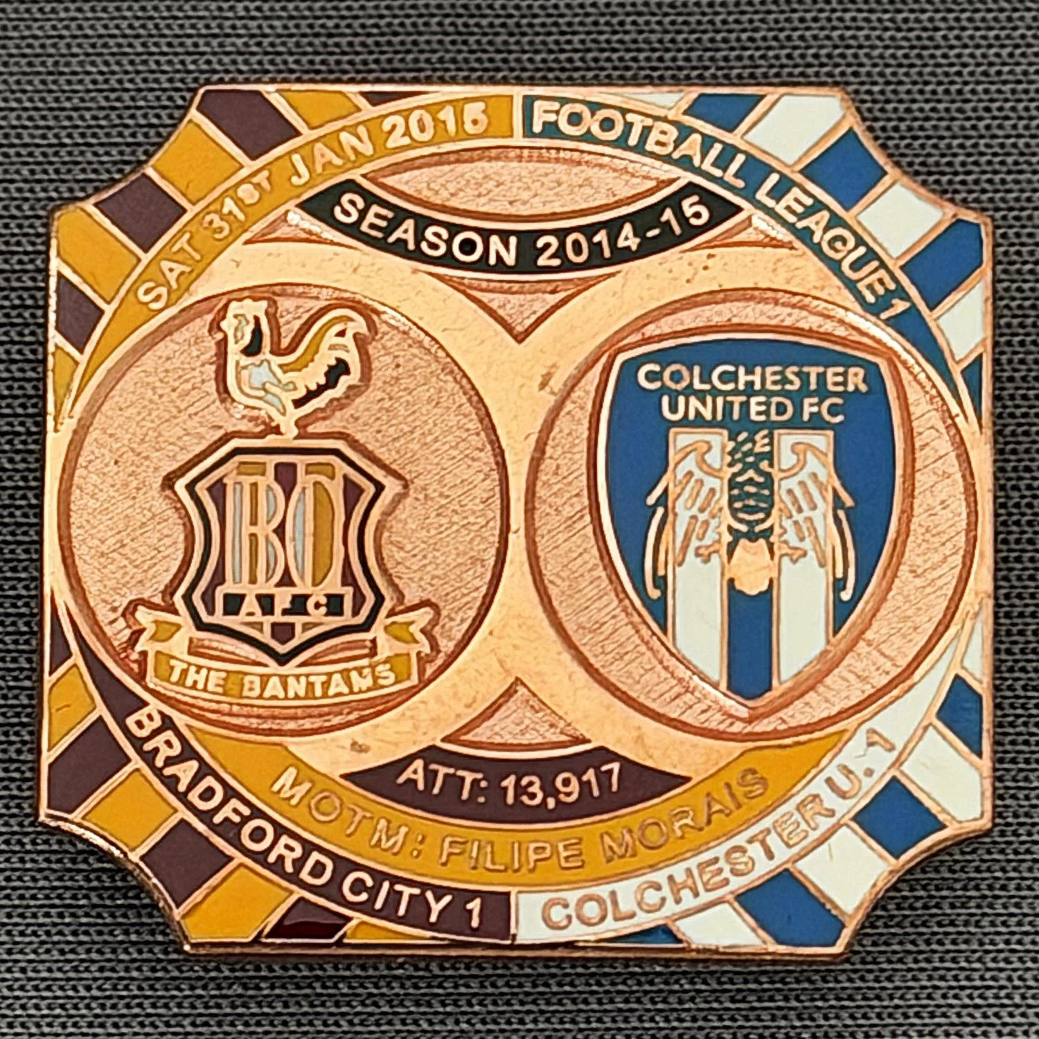Reference Number: BCFIX313
Size: H 26.8 mm x W 28.8 mm
Pin Type: Brooch Pin
Plating: Copper
Value: £12
Manufacturer: Bradford City Badges
Comments: Bradford City v Colchester  United 2014/15, Limited Edition of 1 Badge (Copper Version)