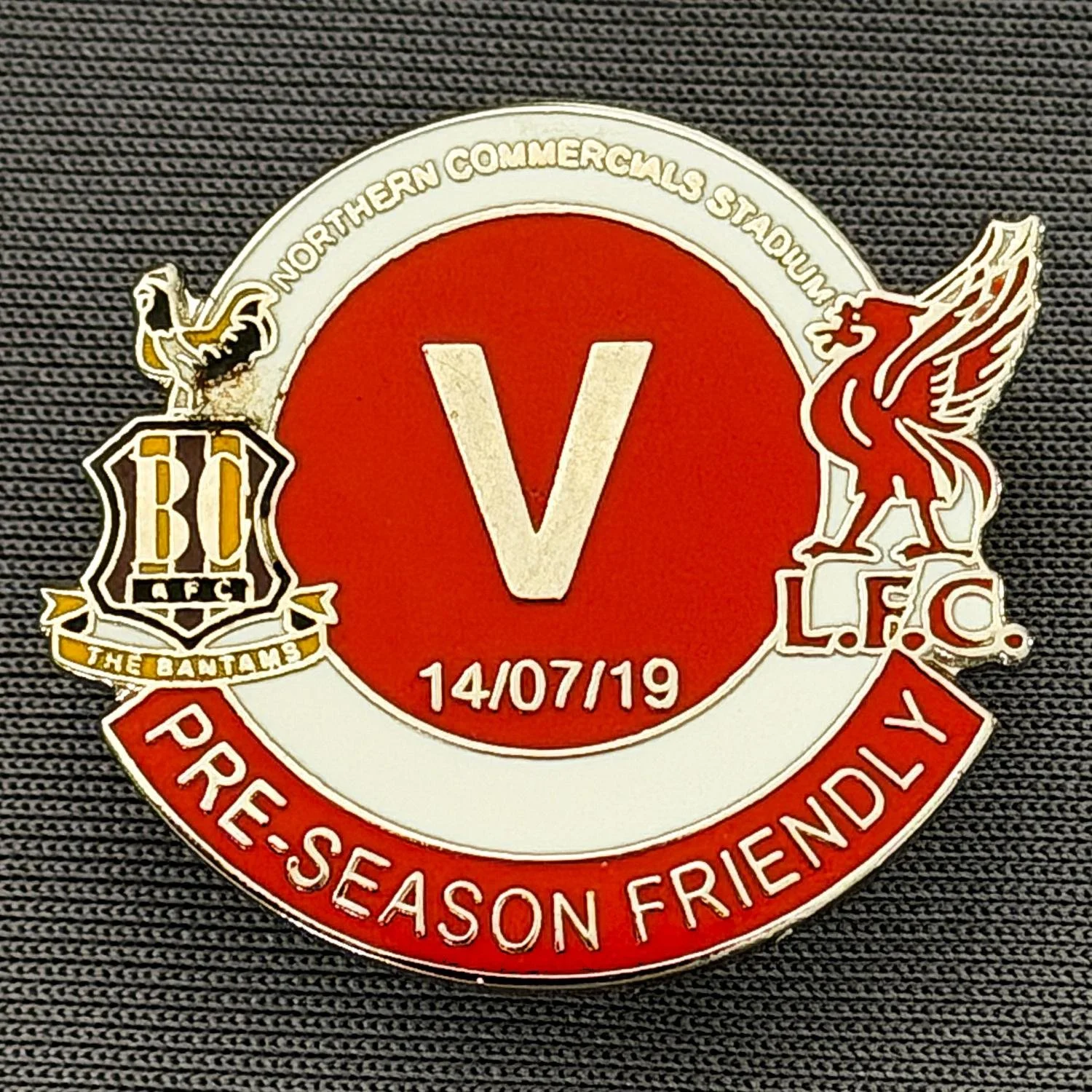 Reference Number: BCOFIX158
Size: H 25 mm x W 28.4 mm
Pin Type: Metal Clutch
Plating: Silver
Value: £5
Manufacturer: Unknown
Comments: Bradford City v Liverpool Pre Season Friendly 2019, Red & White Version