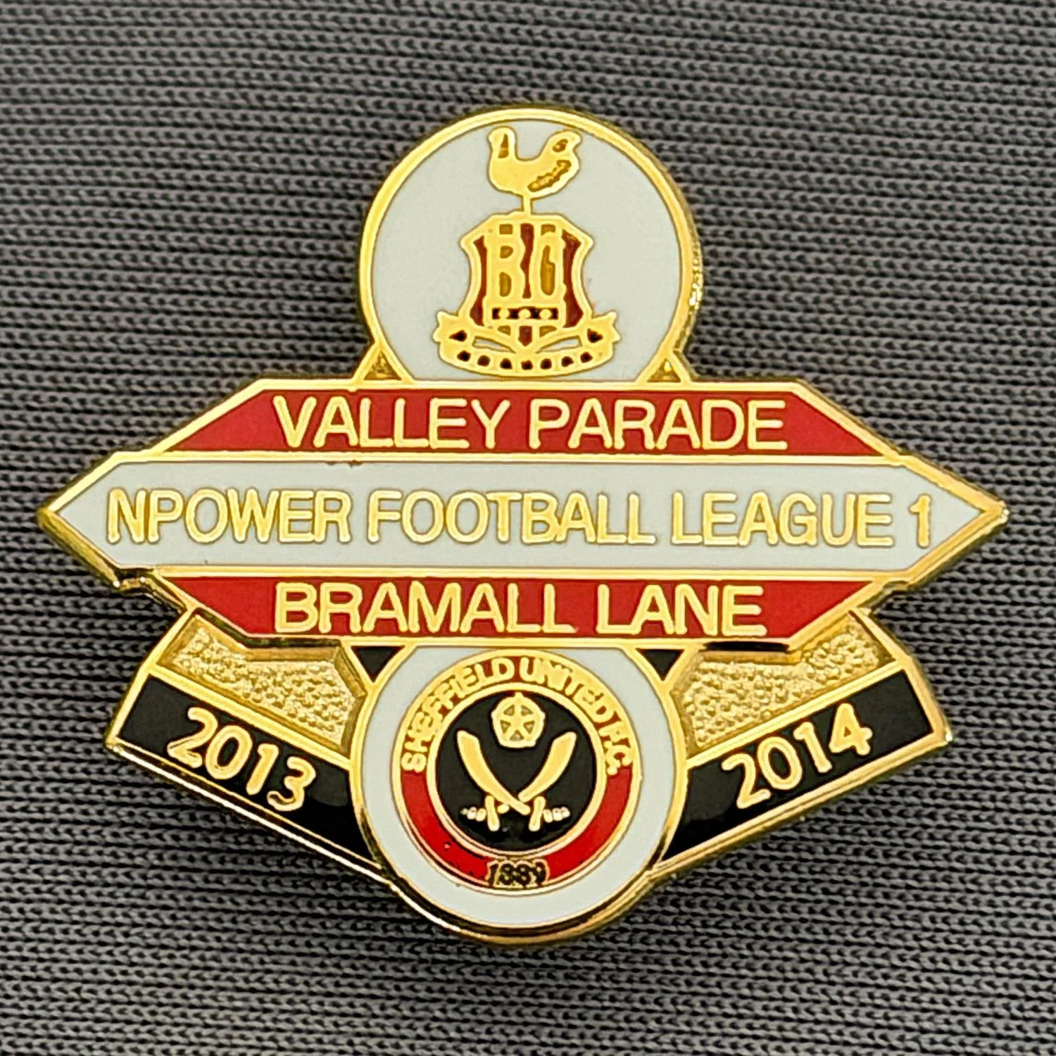Reference Number: BCOFIX088
Size: H 22.5 mm x W 25.6 mm
Pin Type: Brooch Pin
Plating: Chrome
Value: £5
Manufacturer: Unknown
Comments: Bradford City v Sheffield United, League One, White, Red & White Version