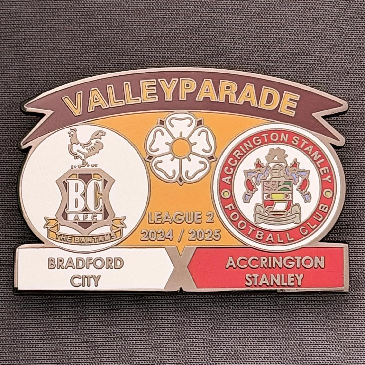 Reference Number: BCFIX431
Size: H 34.3 mm x W 50 mm
Pin Type: Brooch Pin
Plating: Black Nickel
Value: £5
Manufacturer: Unknown
Comments: Bradford City v Accrington Stanley  2024/25.