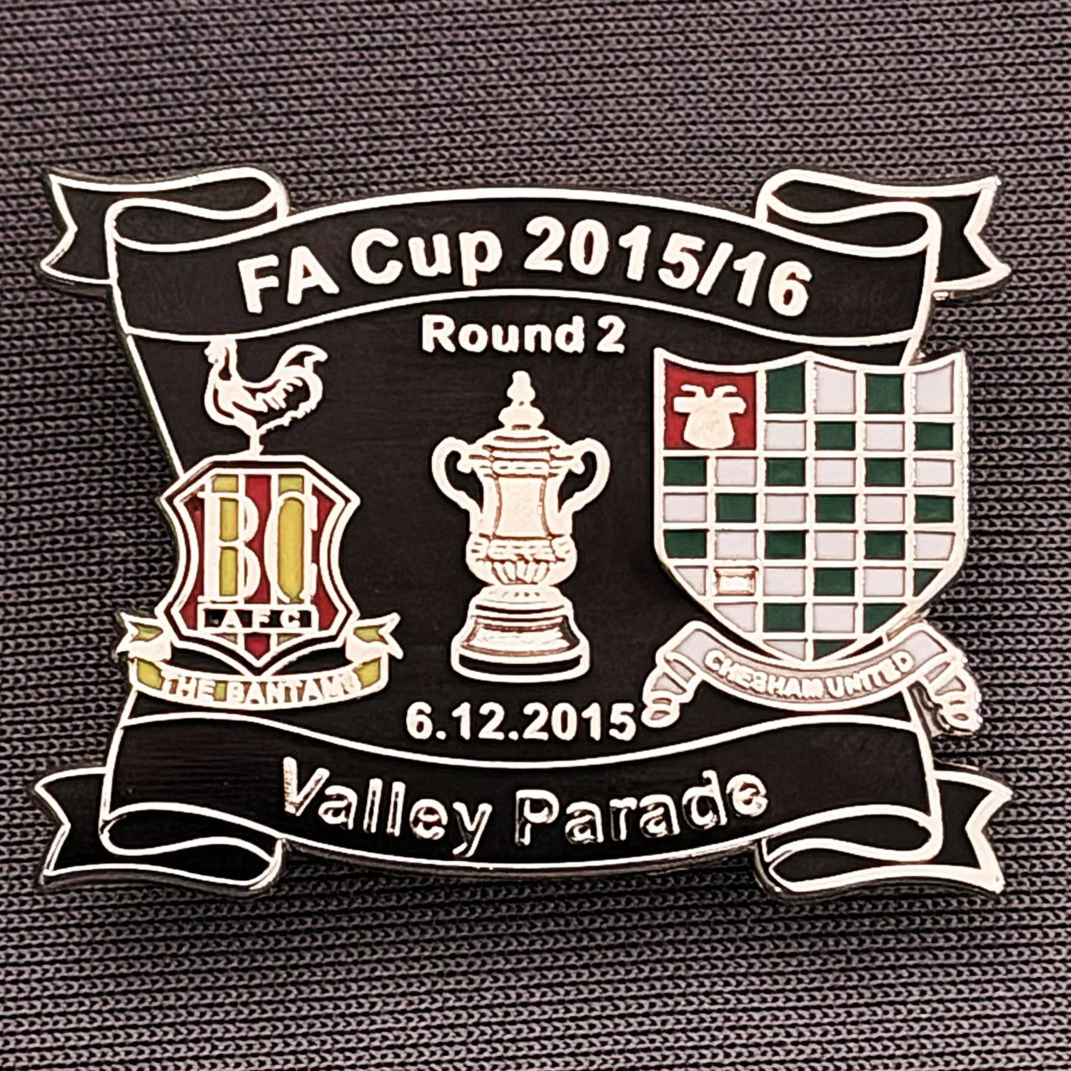 Reference Number: BCFAC144
Size: H 24.5 mm x W 32.5 mm
Pin Type: Metal Clutch
Plating: Silver
Value: £4
Manufacturer: Dan Lloyd
Comments: F.A. Cup Second Round 2015/16 v Chesham United, Black Version