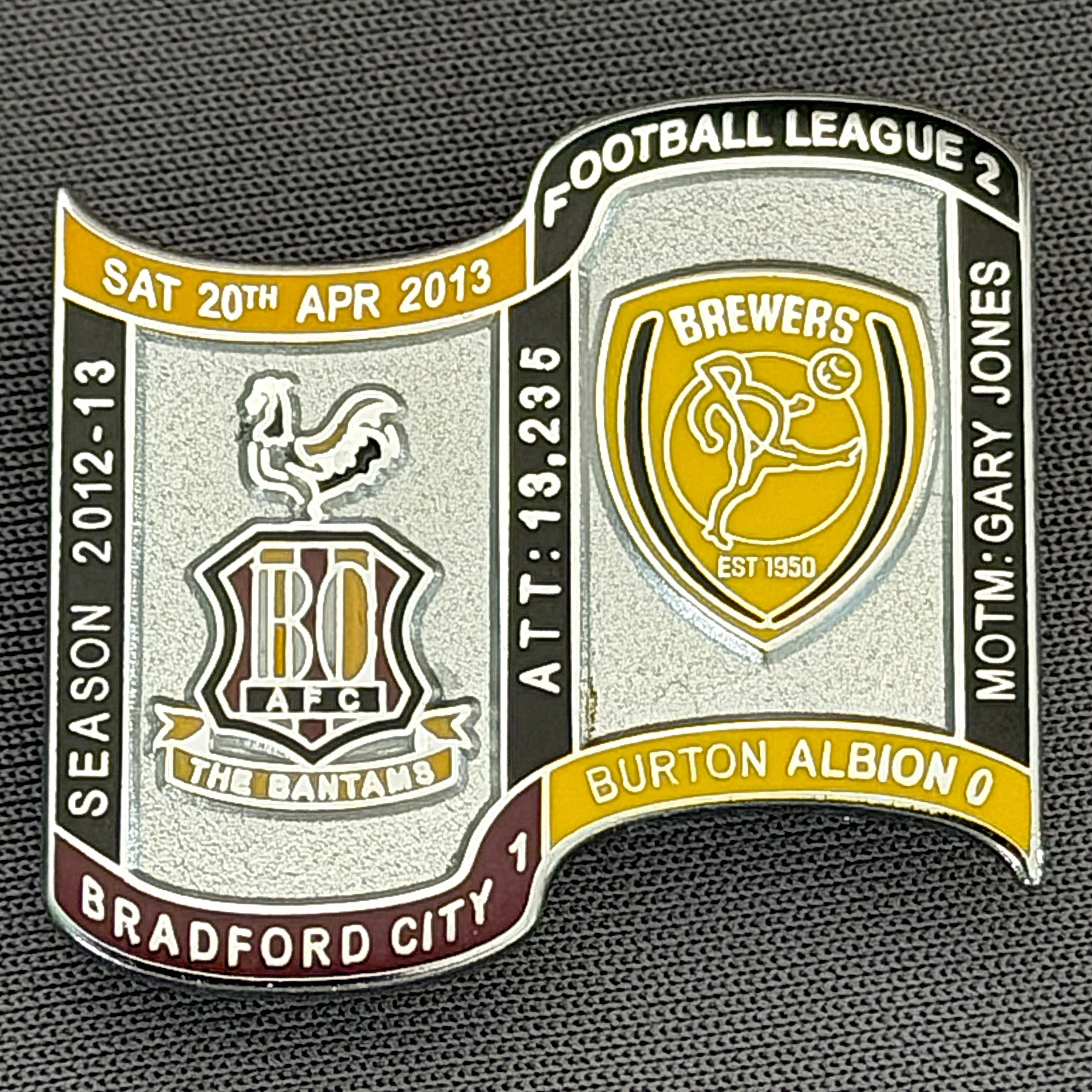 Reference Number: BCFIX161
Size: H 26.9 mm x W 29.2 mm
Pin Type: Brooch Pin
Plating: Chrome
Value: £10
Manufacturer: Bradford City Badges
Comments: Bradford City v Burton Albion  2012/13 Limited Edition 10 Badges (Silver Version)