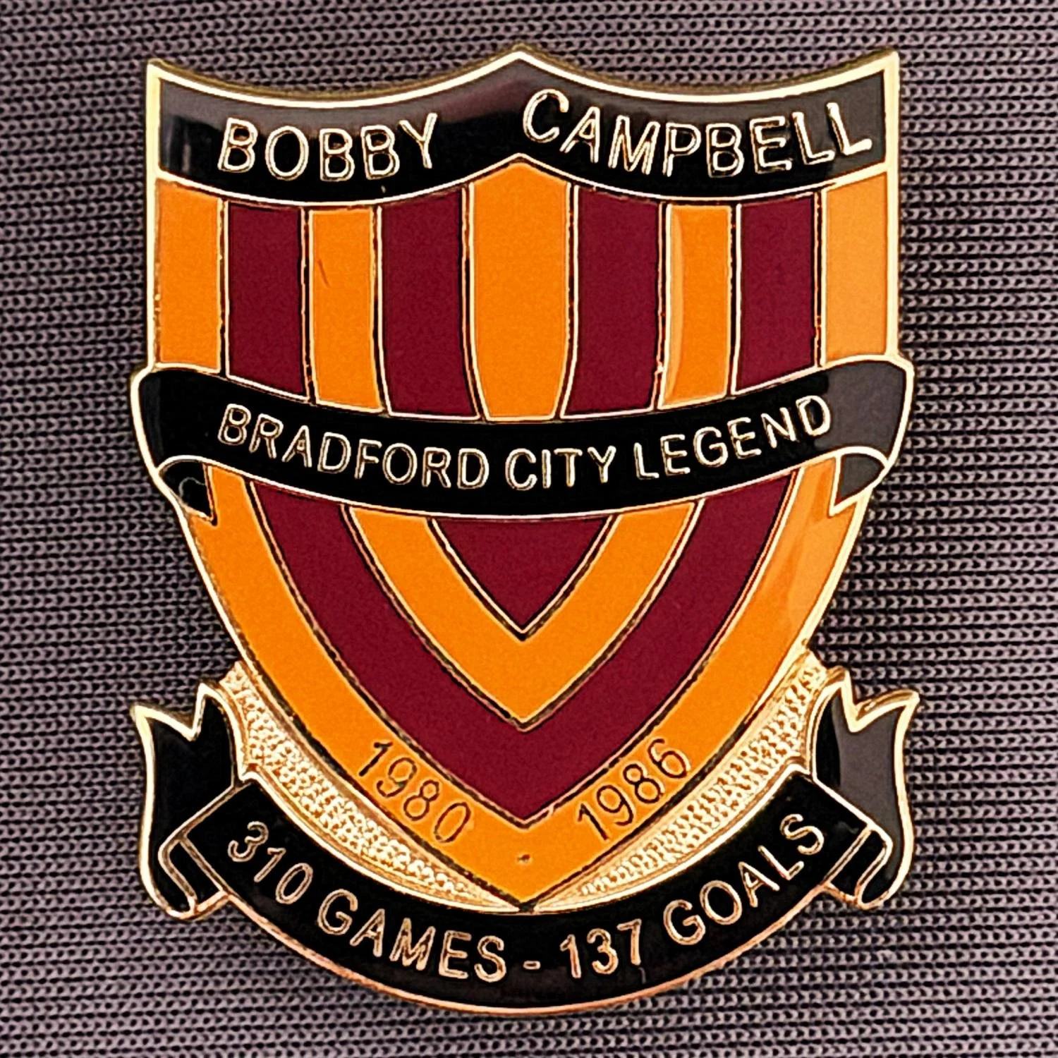 Reference Number: BCUN013
Size: H 32 mm x W 25.9 mm
Pin Type: Metal Clutch
Plating: Gold
Value: £10
Manufacturer: Bradford City Badges
Comments: Bobby Campbell Limited Edition of 25. Boxed Set of 4. Issued 2012. Claret, Amber, & Black Version.