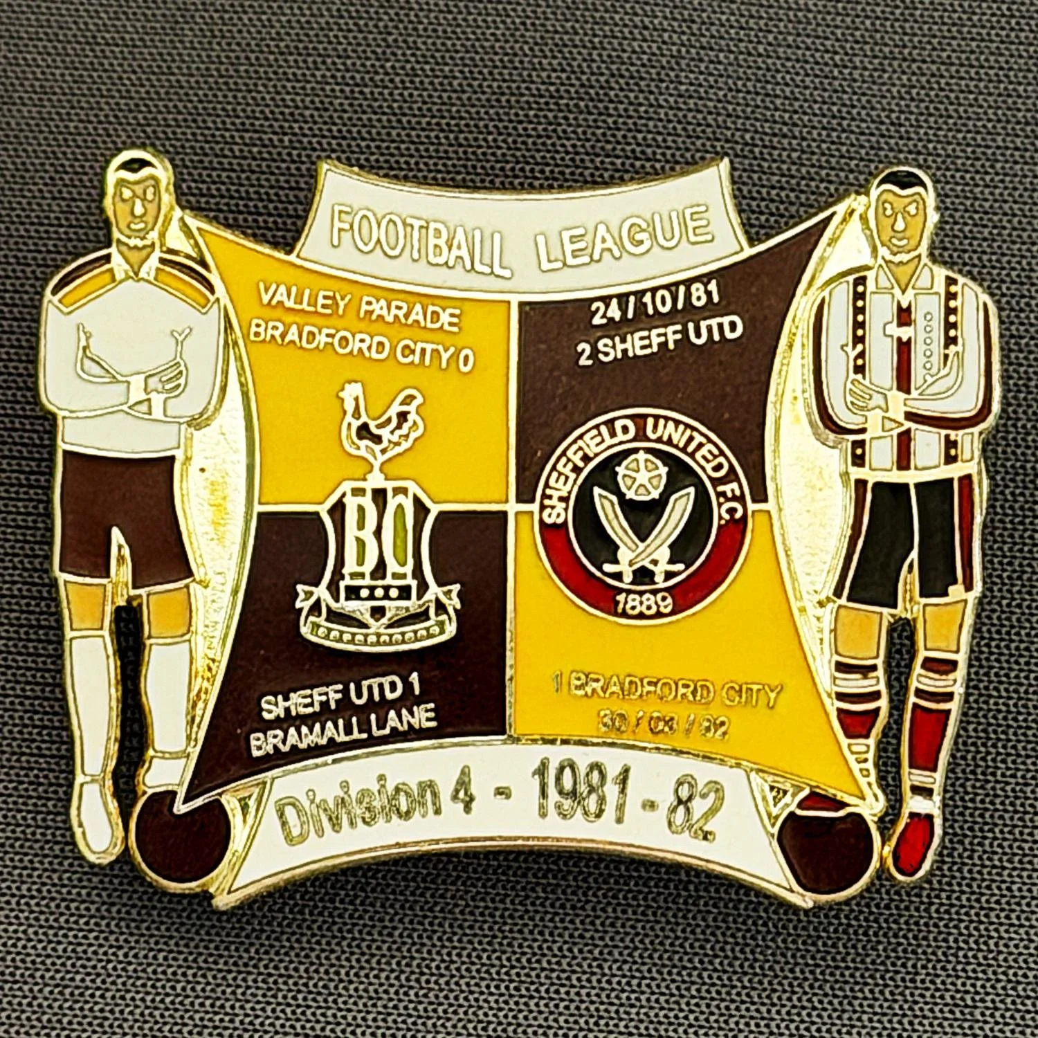 Reference Number: BCOFIX052
Size: H 30.1 mm x W 38 mm
Pin Type: Double Metal Clutch
Plating: Silver
Value: £8
Manufacturer: Unknown
Comments: Bradford City v Sheffield United 1981/82 Division 4, Amber & Black Version