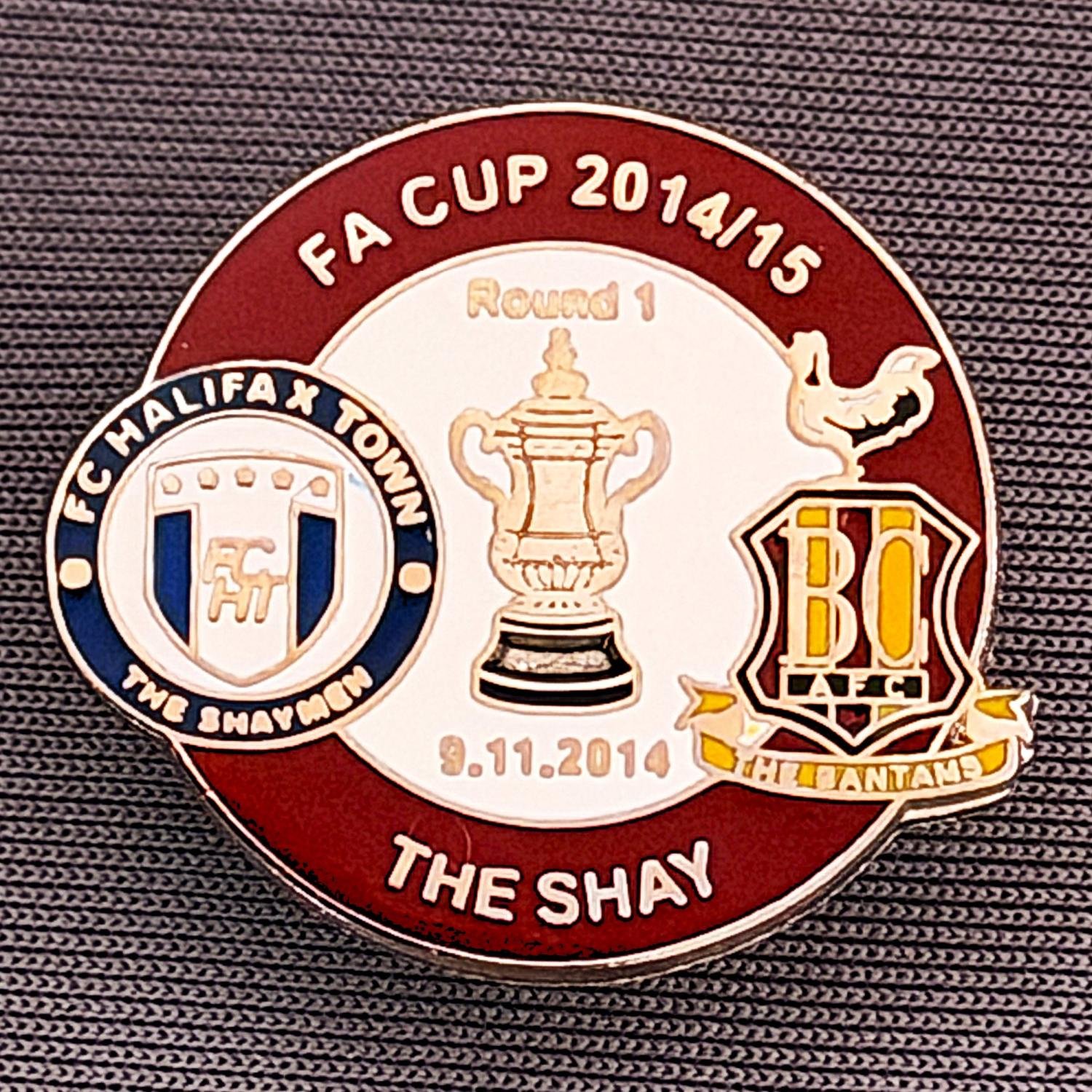 Reference Number: BCFAC055
Size: H 22. 7 mm x W 25.8 mm
Pin Type: Metal Clutch
Plating: Silver
Value: £4
Manufacturer: Dan Lloyd
Comments: F.A. Cup 2014/15 Away v Halifax Town, Claret & White Version