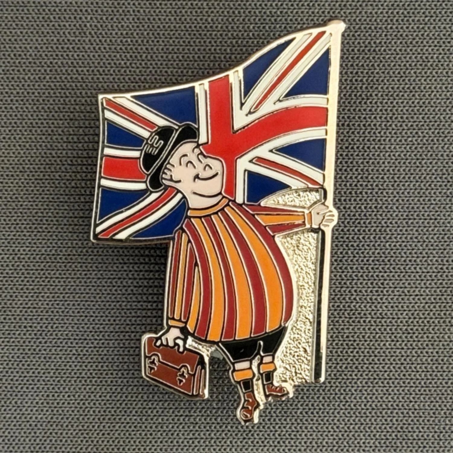 Reference Number: BCFLA024
Size: H 32 mm x W 19 mm
Pin Type: Brooch Pin
Plating: Silver
Value: £8
Manufacturer: Paraders
Comments: City Gent with Union Flag