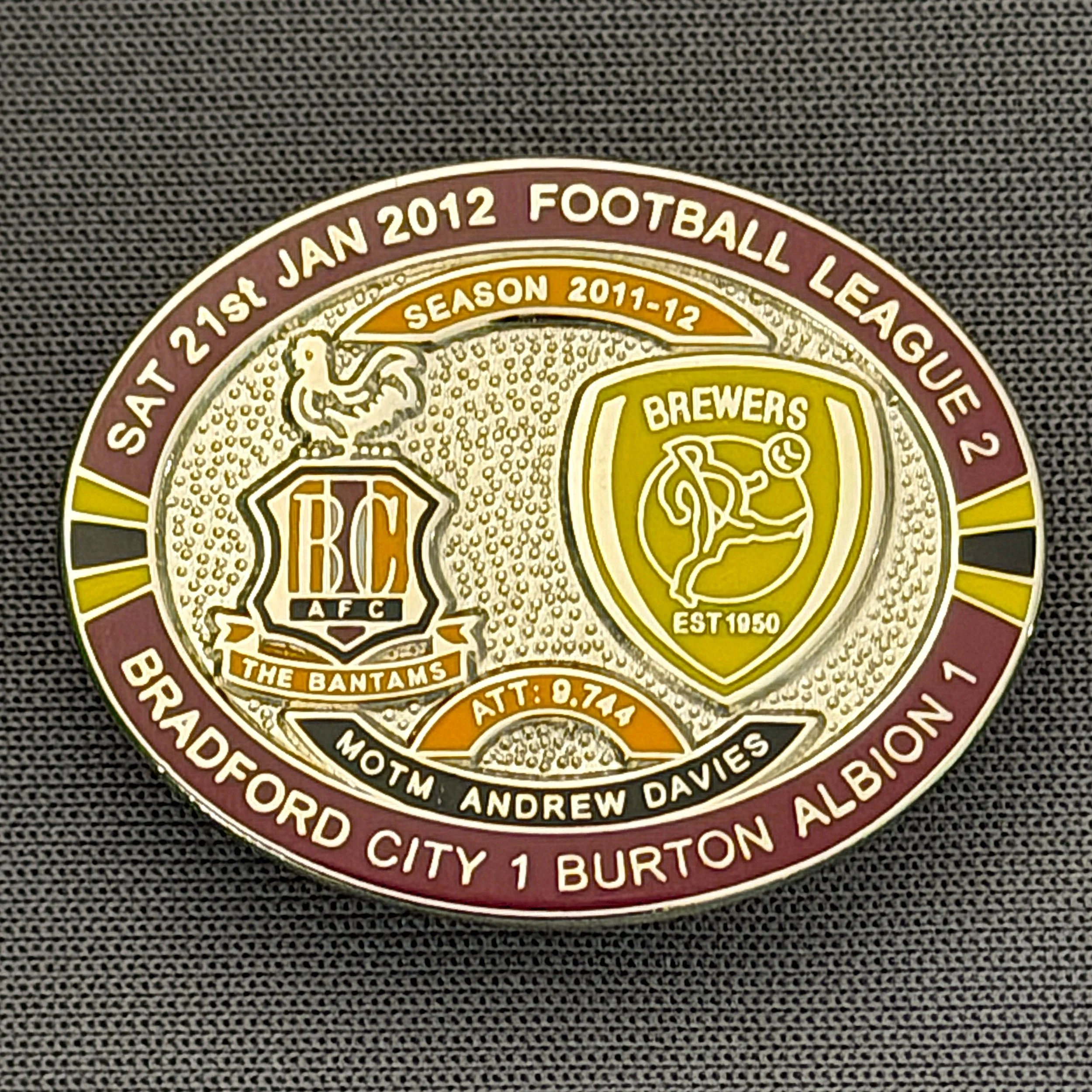 Reference Number: BCFIX106
Size: H 23.6 mm x W 28.7 mm
Pin Type: Brooch Pin
Plating: Silver
Value: £10
Manufacturer: Bradford City Badges
Comments: Bradford City v Burton Albion  2011/12 Limited Edition 20 Badges (Silver Version)