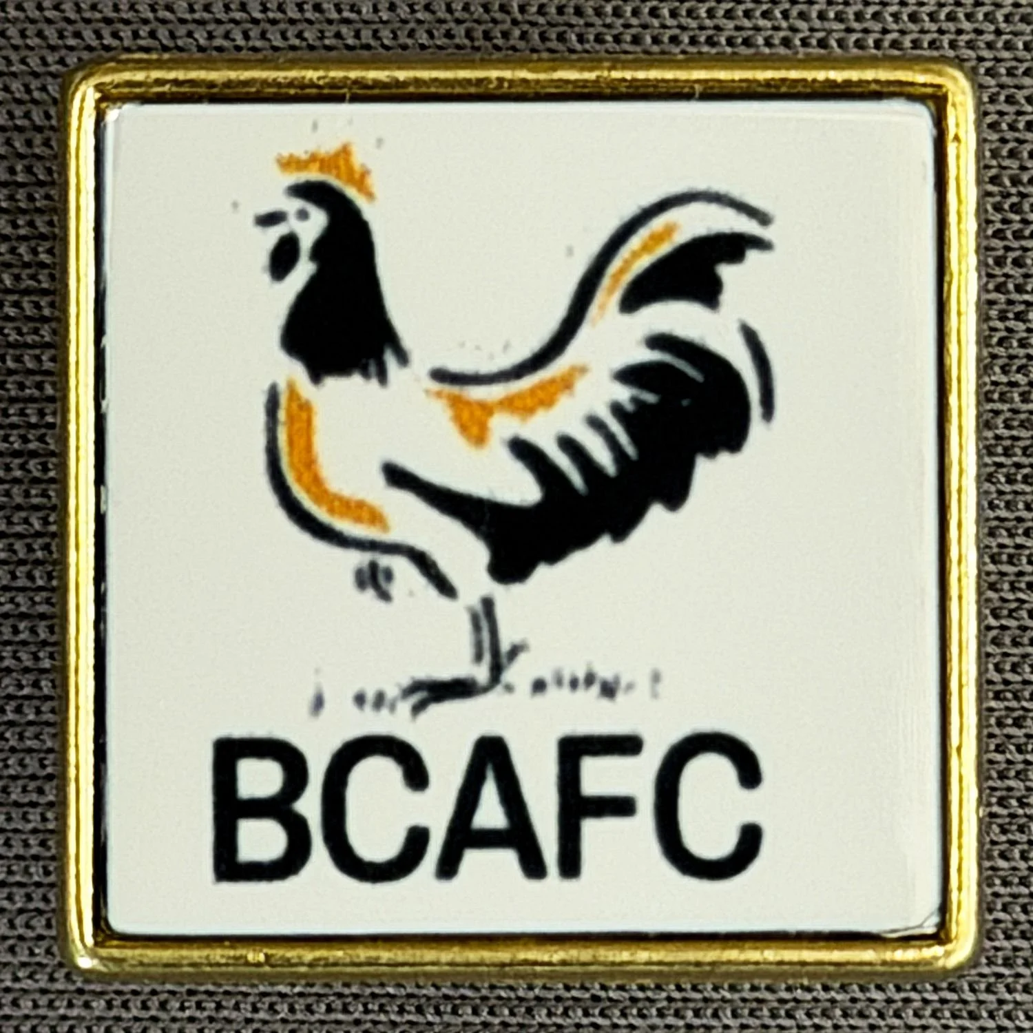 Reference Number: BCBAN089
Size: H 25 mm x W 22.1 mm
Pin Type: Metal Clutch
Plating: Gold
Value: £6
Manufacturer: Artgraph
Comments: Square White Bantam BCAFC