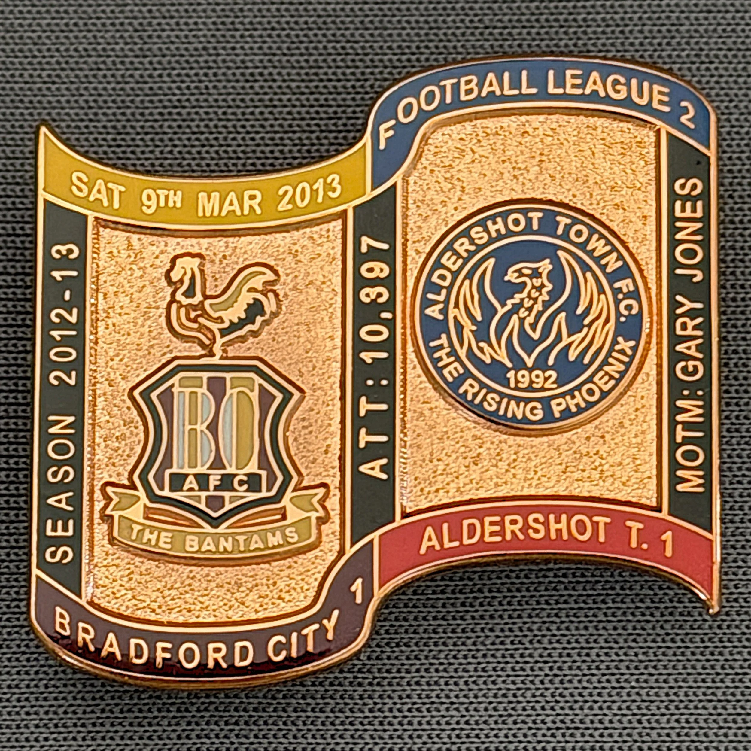 Reference Number: BCFIX178
Size: H 26.9 mm x W 29.2 mm
Pin Type: Brooch Pin
Plating: Copper
Value: £12
Manufacturer: Bradford City Badges
Comments: Bradford City v Aldershot Town 2012/13 Limited Edition 1 Badge (Copper Version)