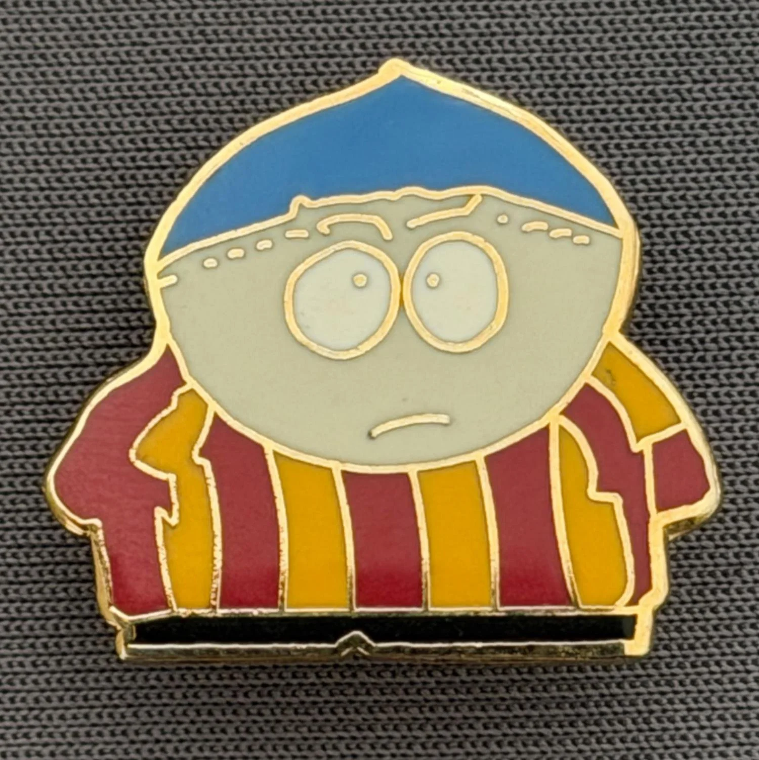 Reference Number: BCCTN025
Size: H 19.9 mm x W 22.1 mm
Pin Type: Brooch Pin
Plating: Gold
Value: £6
Manufacturer: Not Known
Comments: Eric Cartman South Park in Bradford City Kit