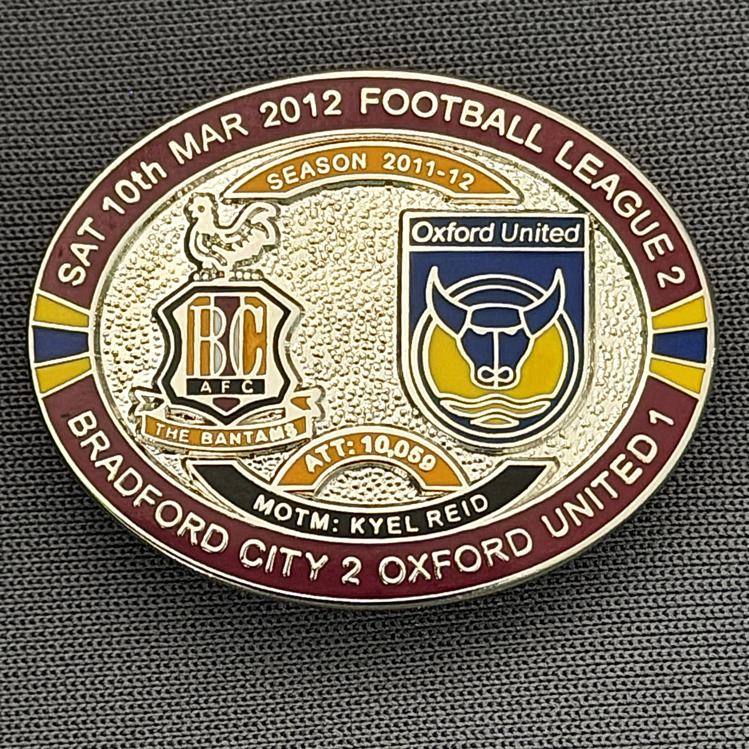 Reference Number: BCFIX110
Size: H 23.6 mm x W 28.7 mm
Pin Type: Brooch Pin
Plating: Silver
Value: £10
Manufacturer: Bradford City Badges
Comments: Bradford City v Oxford United  2011/12 Limited Edition 20 Badges (Silver Version)