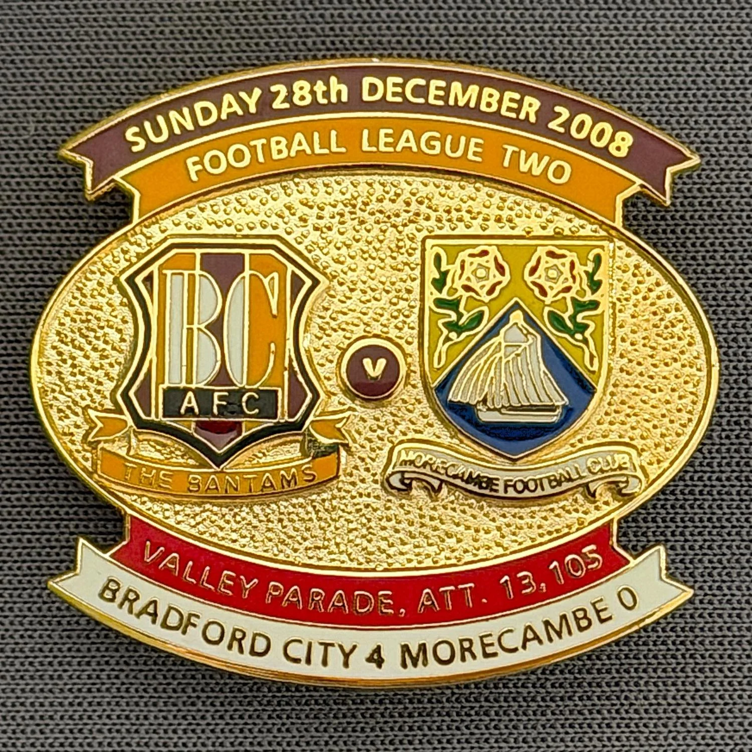 Reference Number: BCFIX012
Size: H 26.6 mm x W 29 mm
Pin Type: Brooch Pin
Plating: Gold
Value: £8
Manufacturer: Bradford City Badges
Comments: Bradford City v Morecambe 2008/09 Limited Edition 100 Badges

