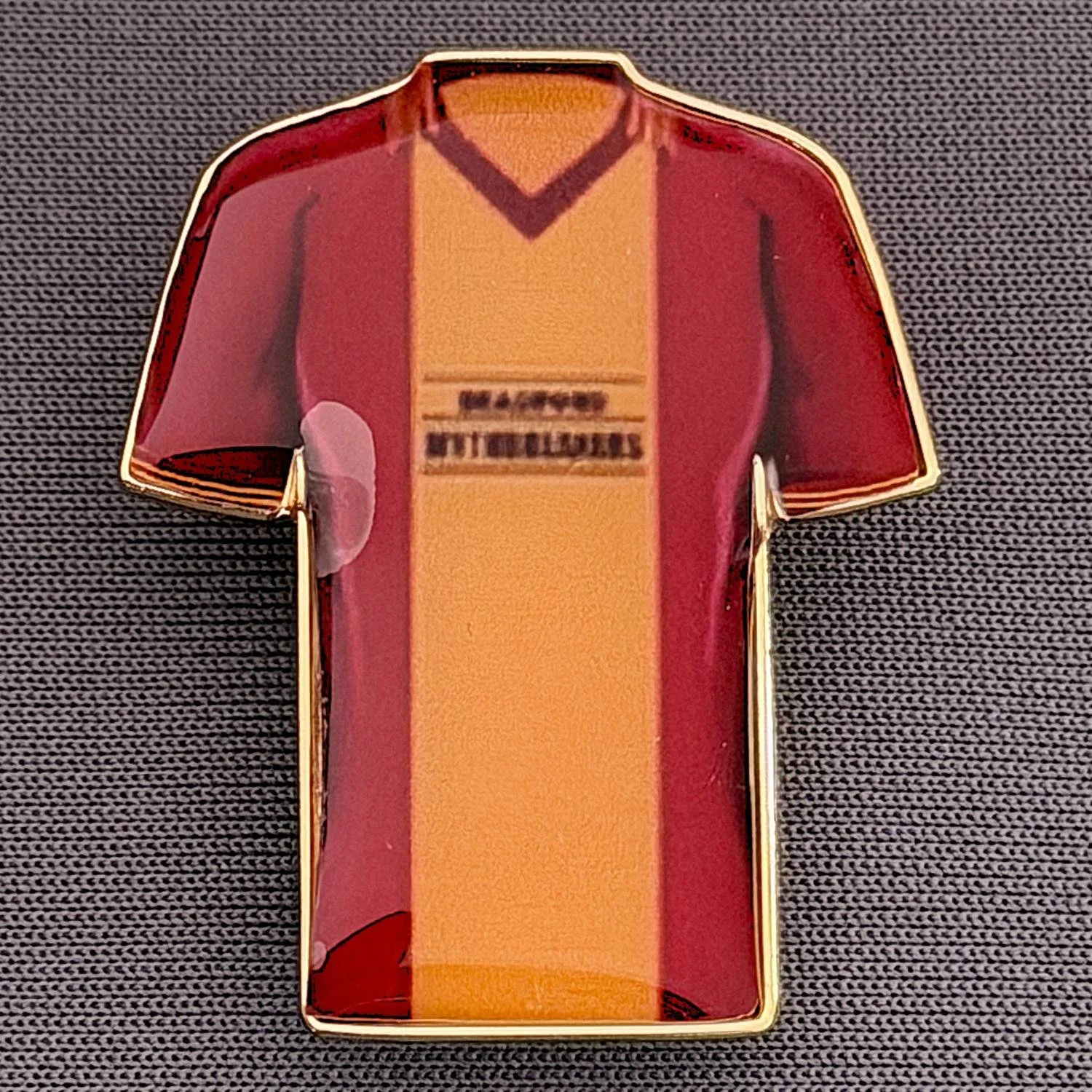 Reference Number: BCKIT091
Size: H 33 mm x W 27.1 mm
Pin Type: Metal Clutch
Plating: Gold
Value: £4
Manufacturer: Blue Badge Design
Comments: Bradford City 1984/85 Away Kit, Plastic Dome
