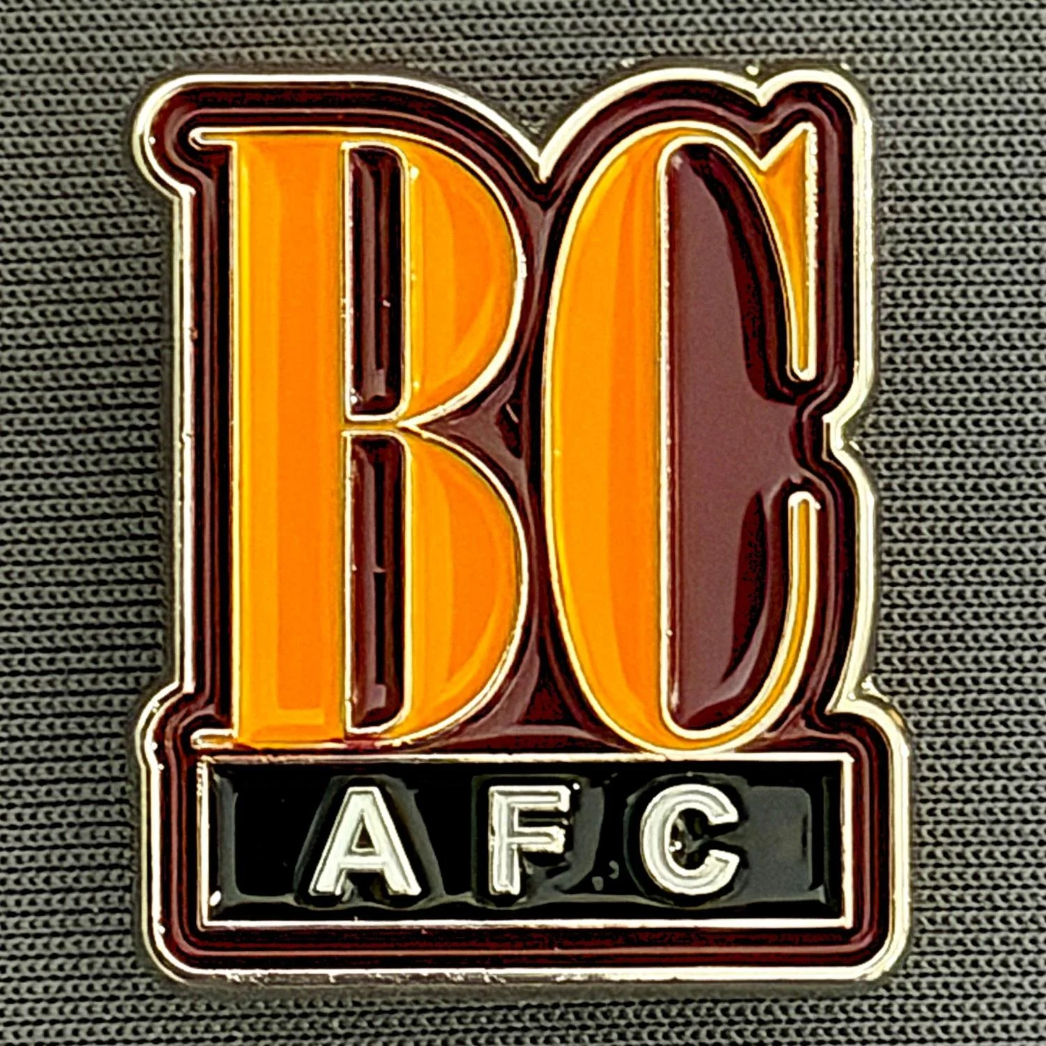 Reference Number: BCBCFC075
Size: H 25.4 mm x W 21.6 mm
Pin Type: Metal Clutch
Plating: Silver
Value: £5
Manufacturer: Bradford City Shop
Comments: BCAFC Claret, Amber & Black