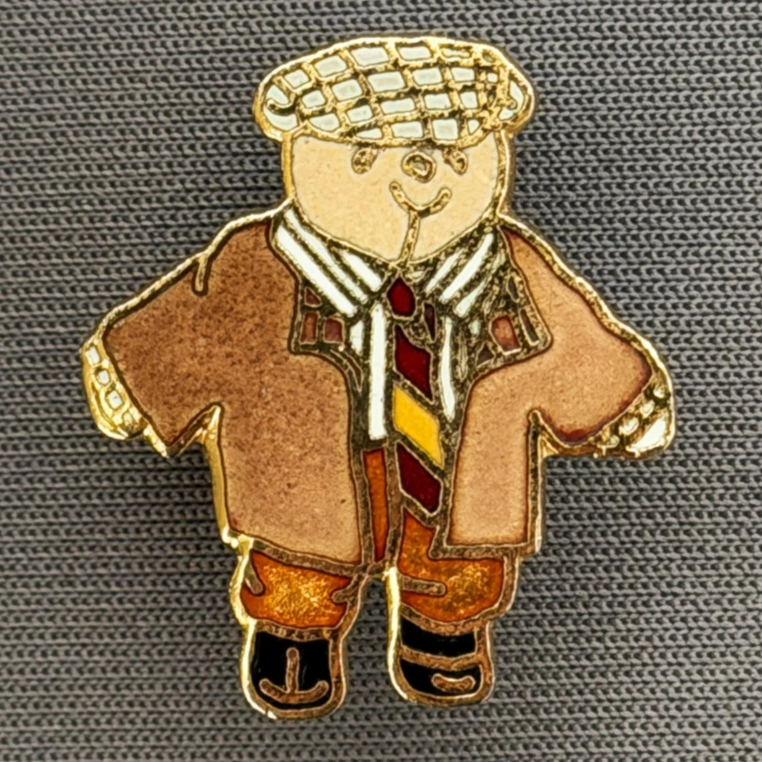 Reference Number: BCCTN028
Size: H 23 mm x W 20.1 mm
Pin Type: Metal Clutch
Plating: Gold
Value: £8
Manufacturer: Not Known
Comments: Teddy Bear dressed  in Bradford City Tie
