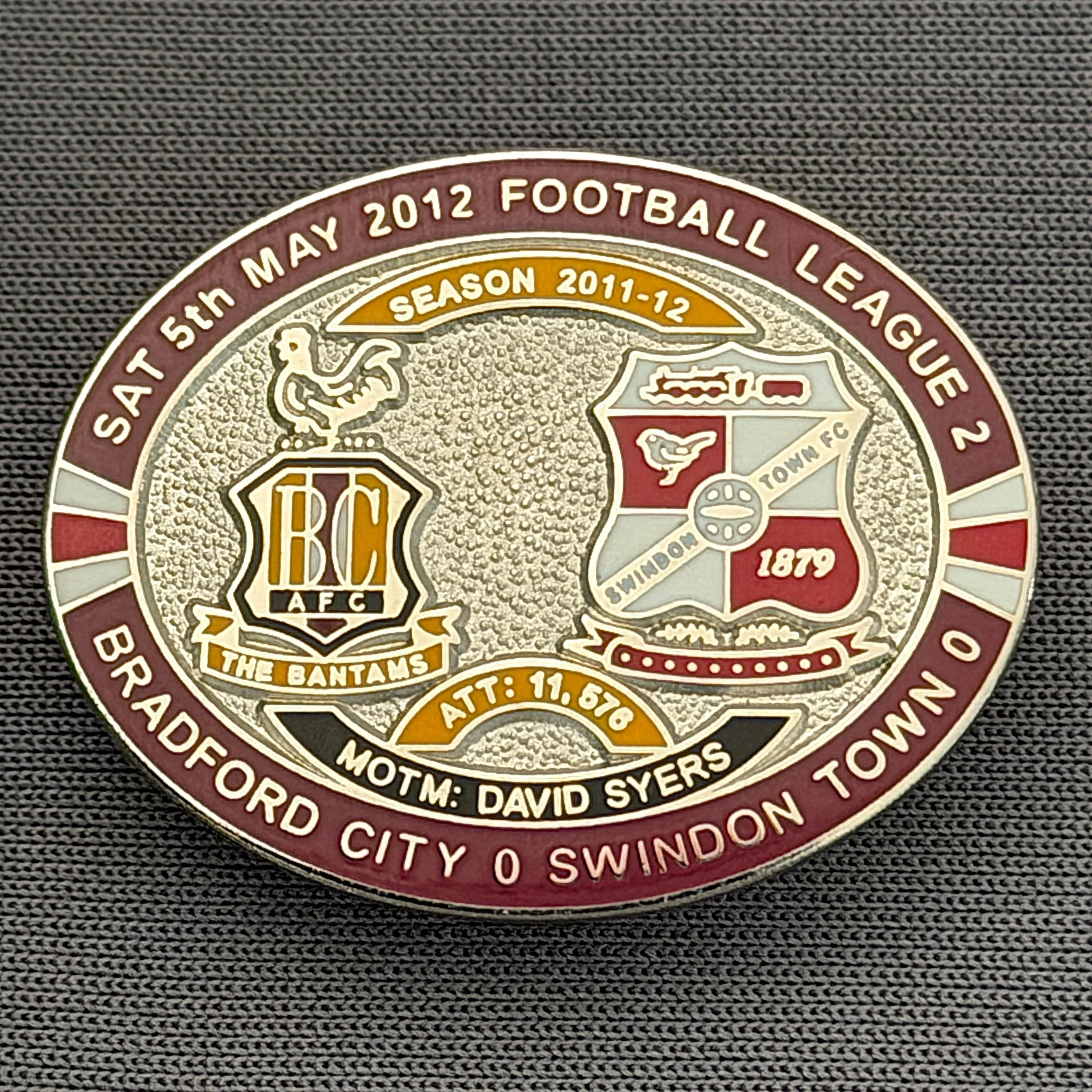 Reference Number: BCFIX115
Size: H 23.6 mm x W 28.7 mm
Pin Type: Brooch Pin
Plating: Silver
Value: £10
Manufacturer: Bradford City Badges
Comments: Bradford City v Swindon Town  2011/12 Limited Edition 20 Badges (Silver Version)