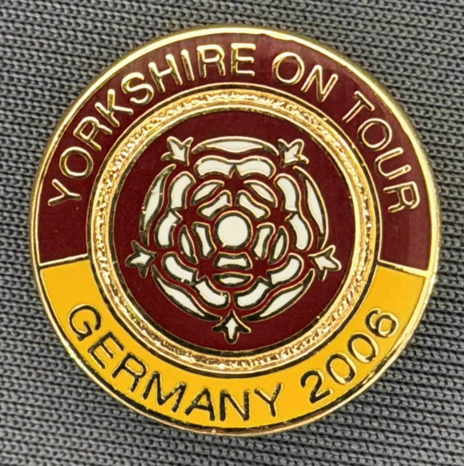 Reference Number: BCYR010
Size: D 19.2 mm
Pin Type: Brooch Pin
Plating: Gold
Value: £8
Manufacturer: Unknown
Comments: Claret & Amber Yorkshire on Tour Germany 2006 Rose 