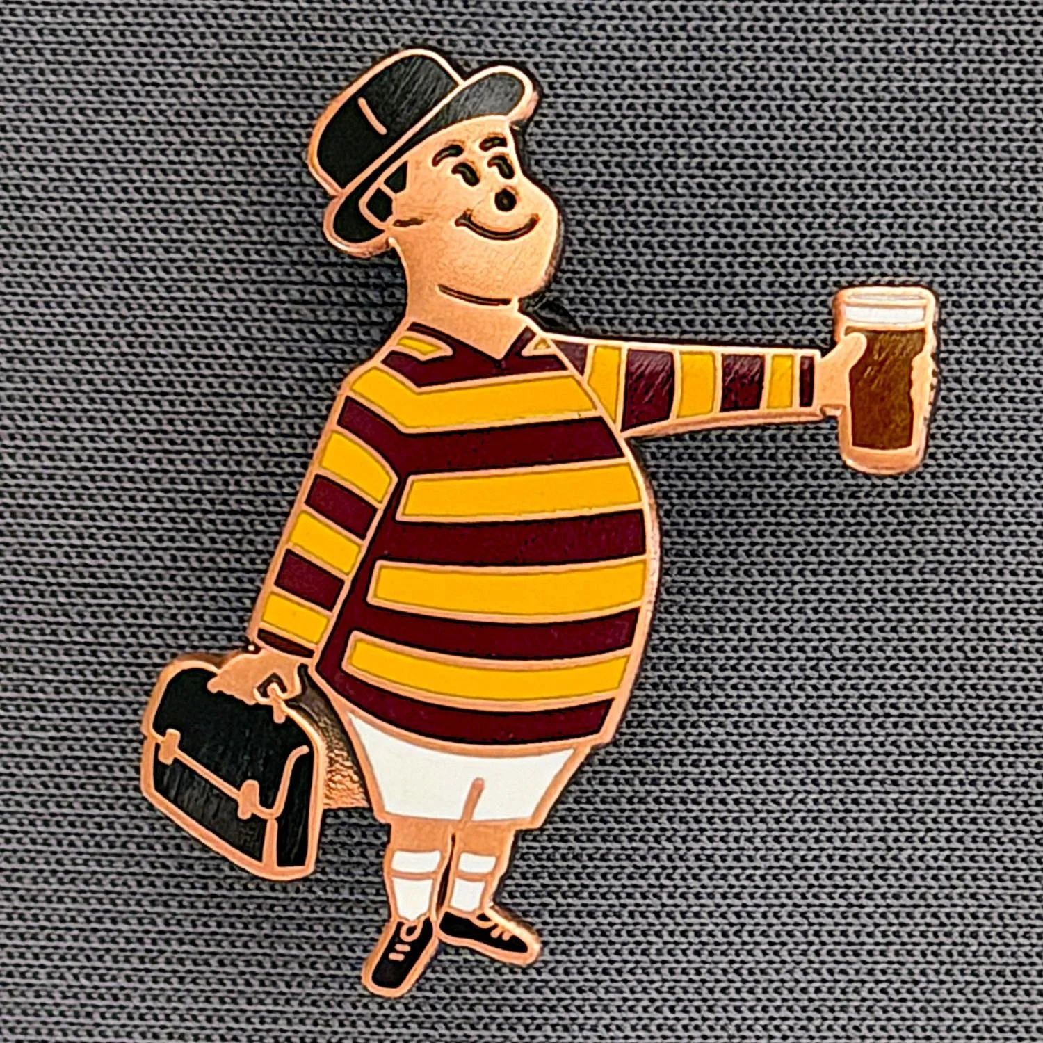 Reference Number: BCGEN079
Size: H 28.8 mm x W 20.9 mm
Pin Type: Brooch Pin
Plating: Antique Copper
Value: £20
Manufacturer: Bradford City Badges
Comments: City Gent Beer, Black Briefcase. One Off Badge.