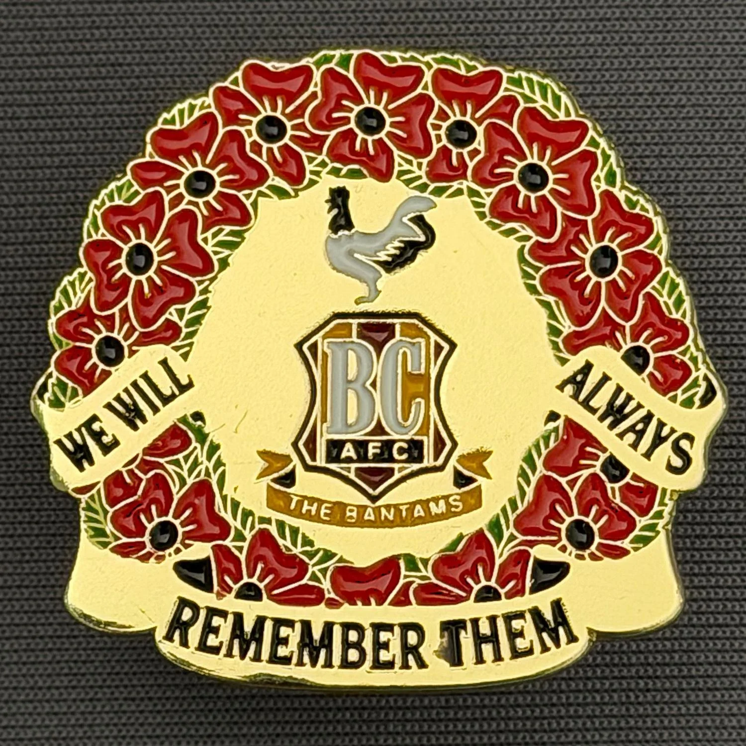 Reference Number: BCPOP007
Size: H 30.4 mm x W 32.2 mm
Pin Type: Metal Clutch
Plating: Gold
Value: £5
Manufacturer: Unknown
Comments: Bradford City Poppy Wreath, We Will Always Remember Them
