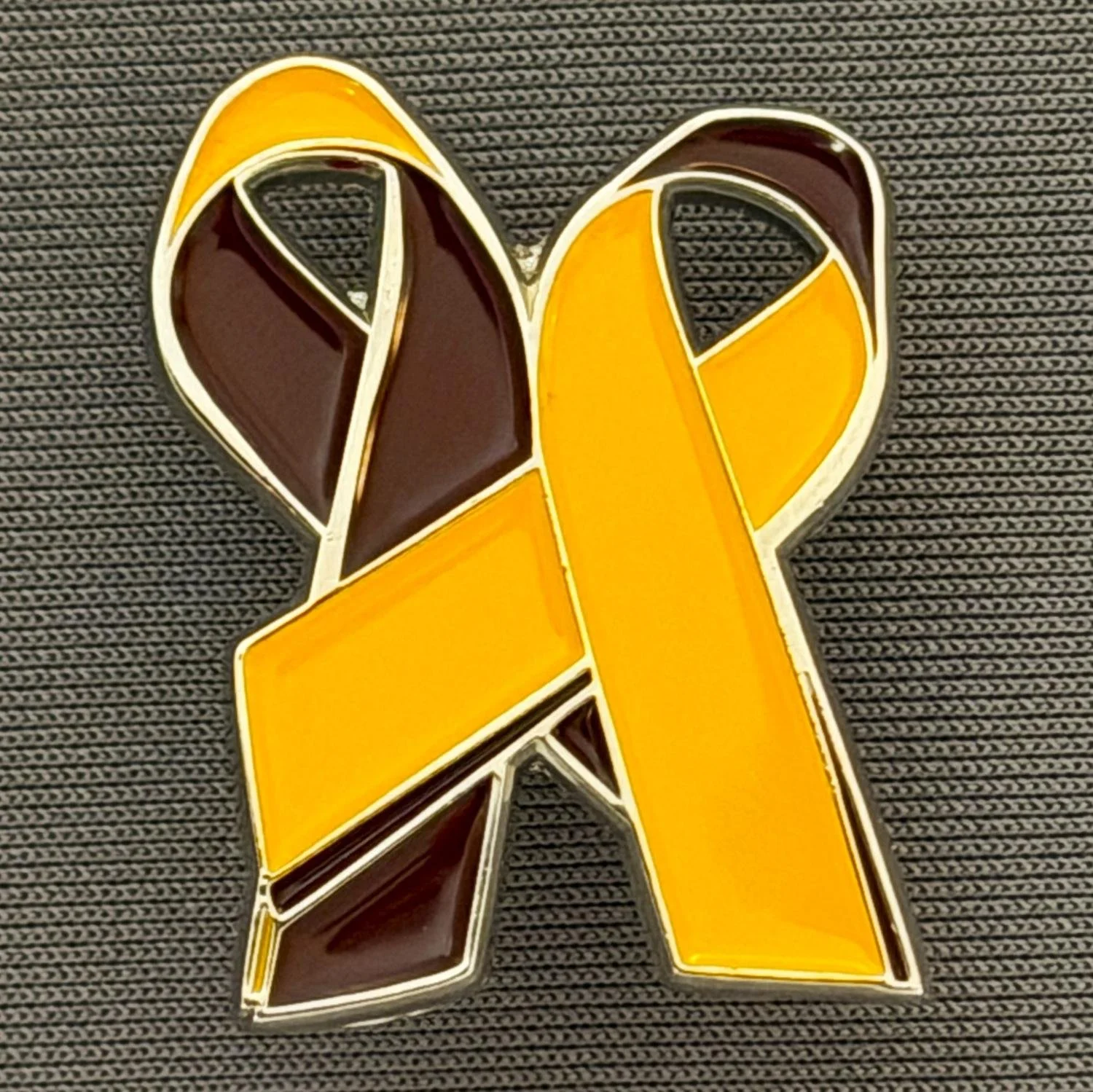 Reference Number: BCFIR022
Size: H 28.6 mm x W 22.2 mm
Pin Type: Metal Clutch
Plating: Silver
Value: £8
Manufacturer: Bradford City Ribbons
Comments: Claret and Amber ribbon produced by Georgia Thornton to raise money for PSBRU